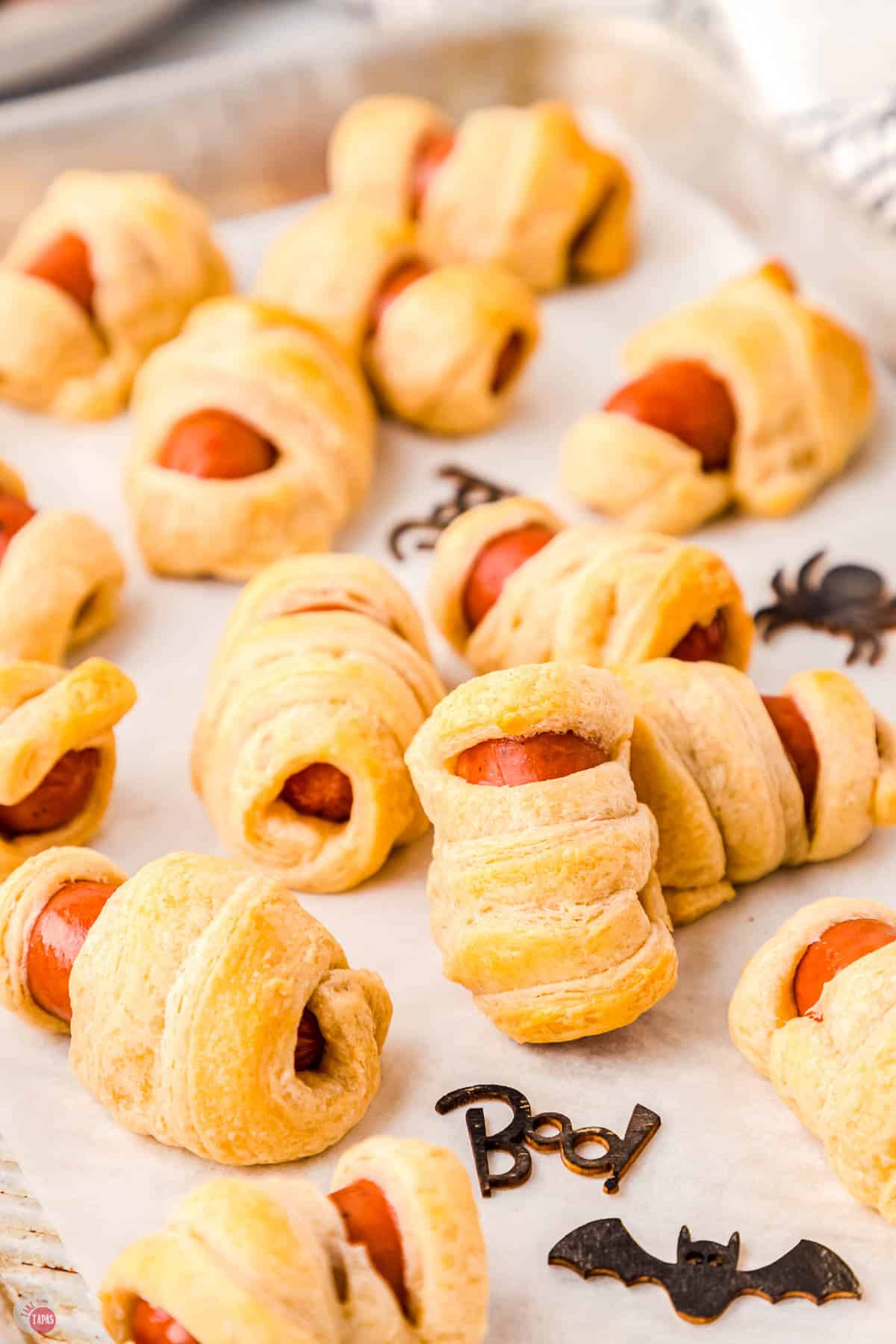 hot dog mummies on a baking sheet