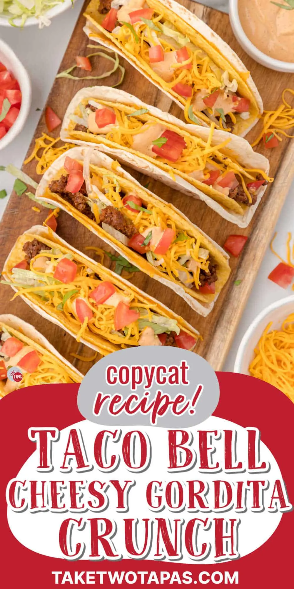 tacos lined up on a wood platter
