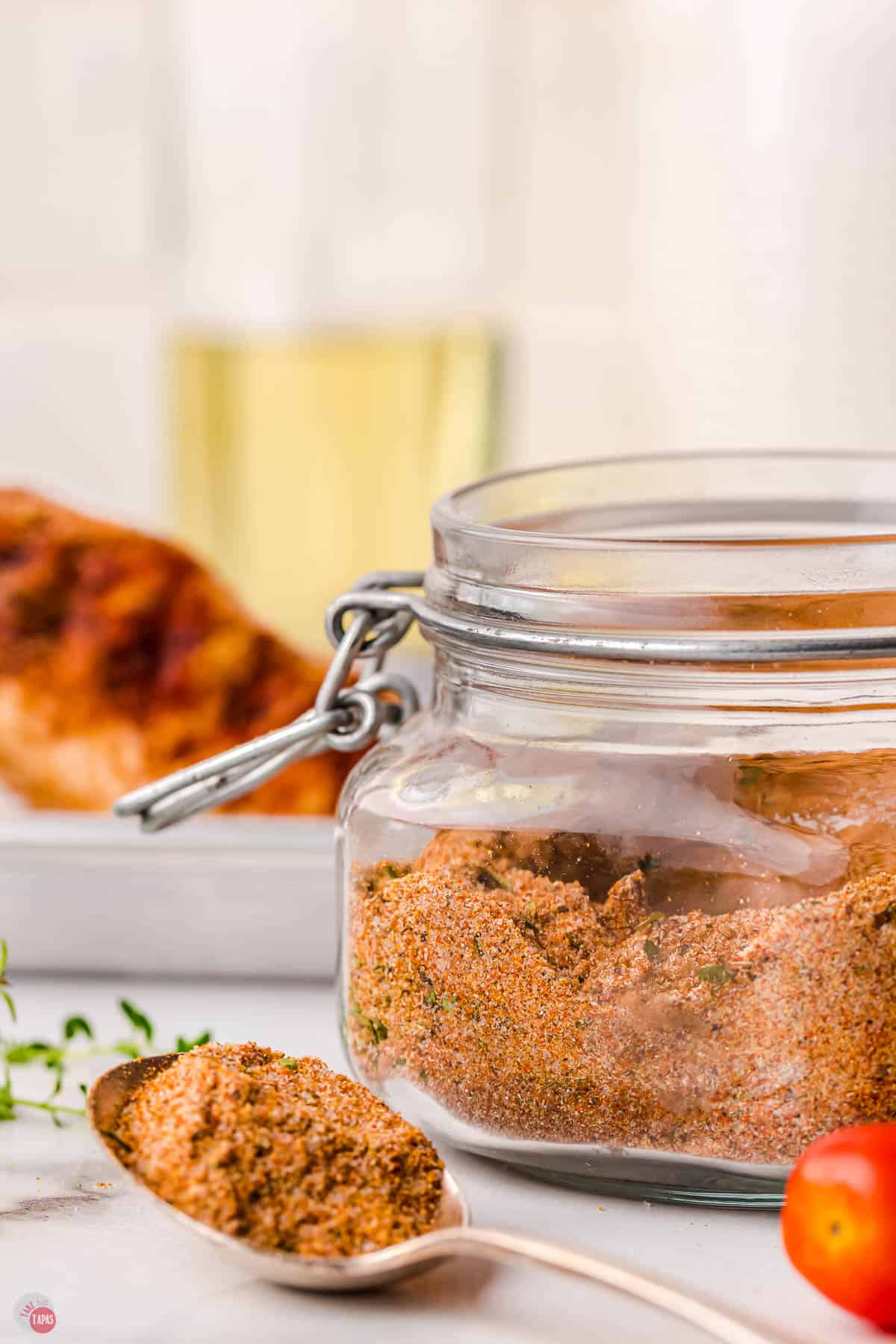 spoon of spices next to a jar