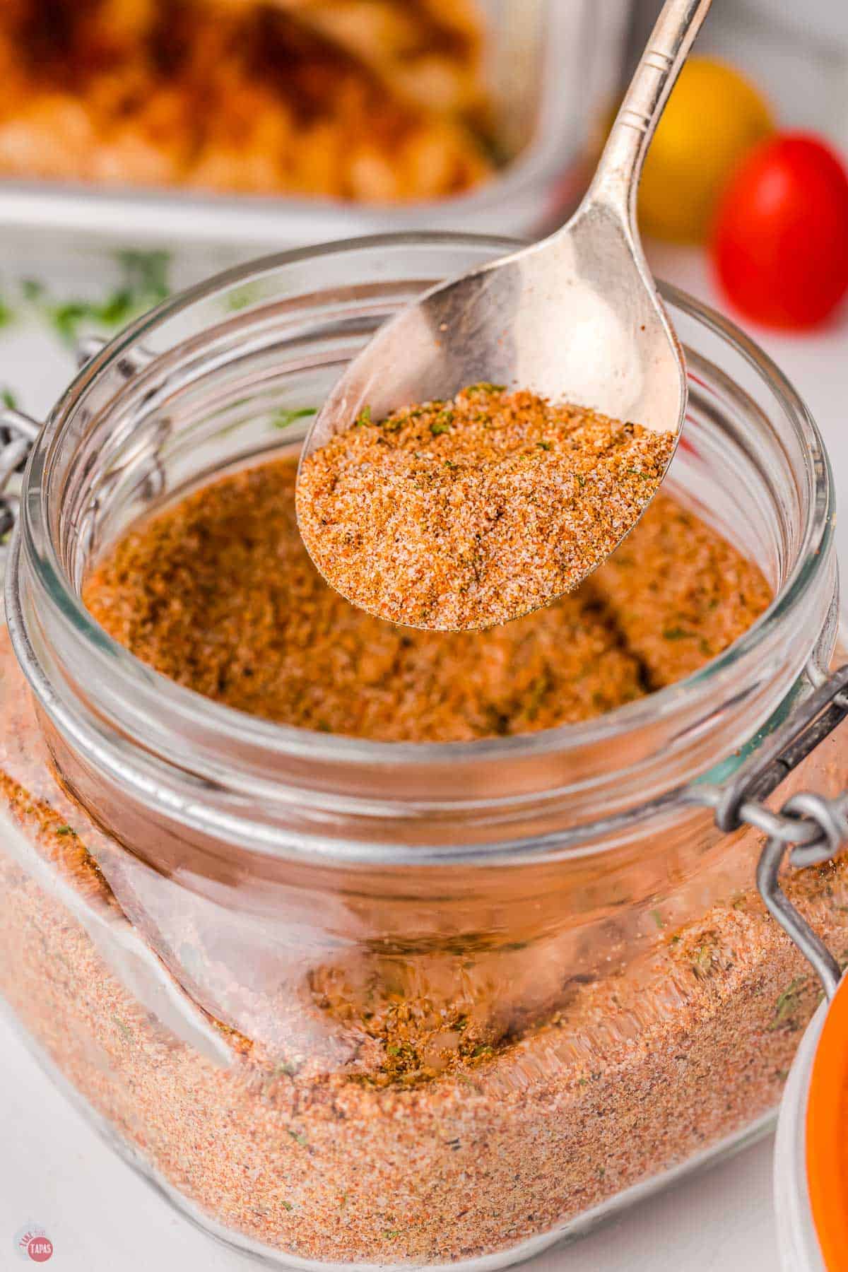 spoon of bbq seasoning above a jar
