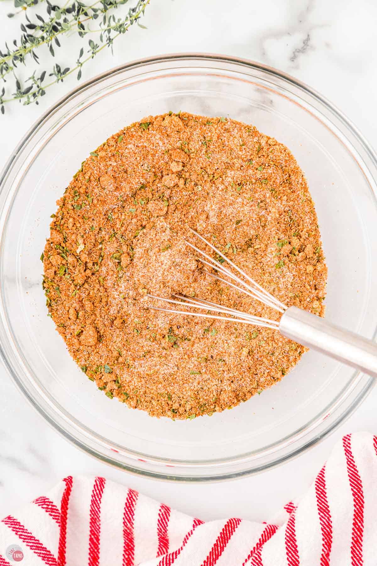 barbecue spice rub in a bowl with a whisk