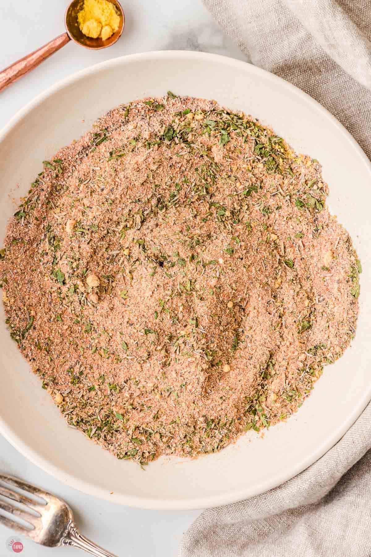 stir homemade seasonings in a bowl