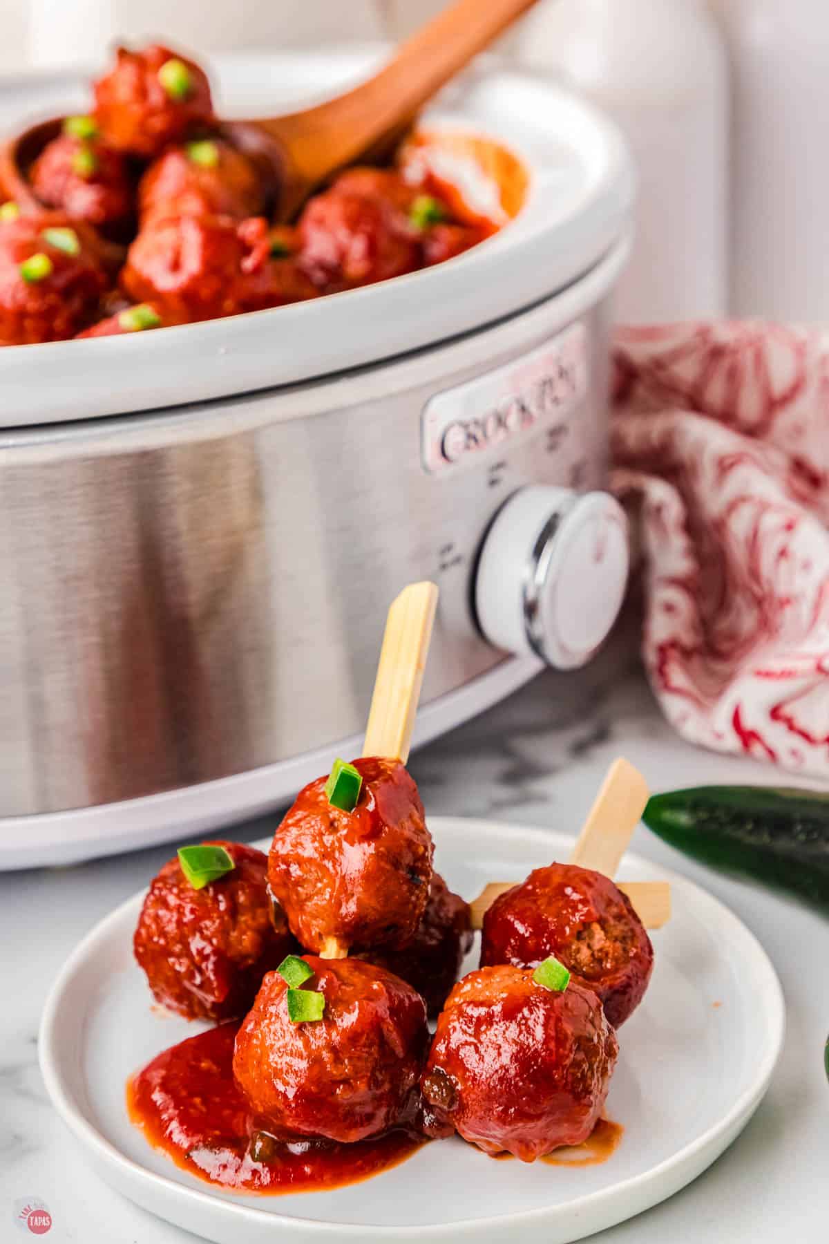 plate of meatballs with wooden forks