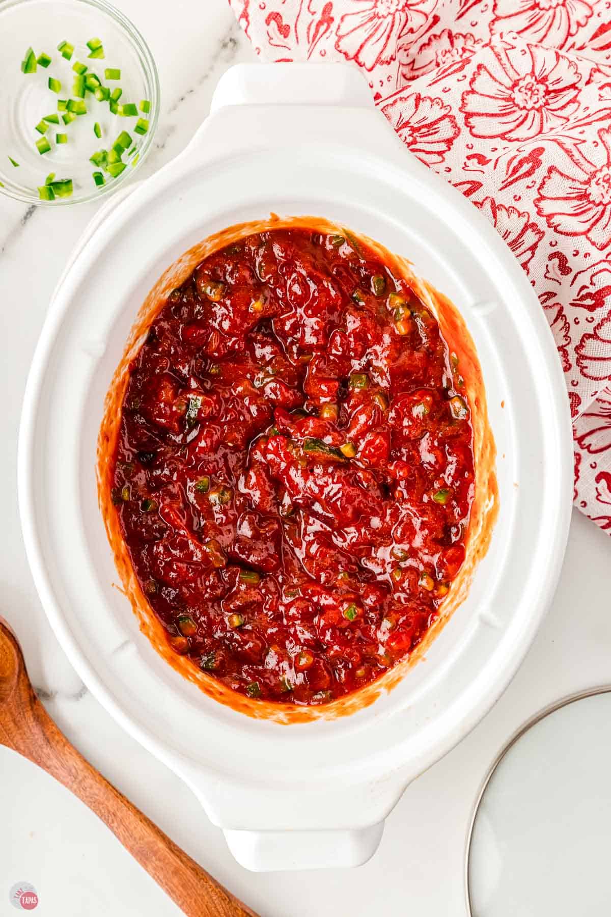 sauce for party meatballs in a white slow cooker