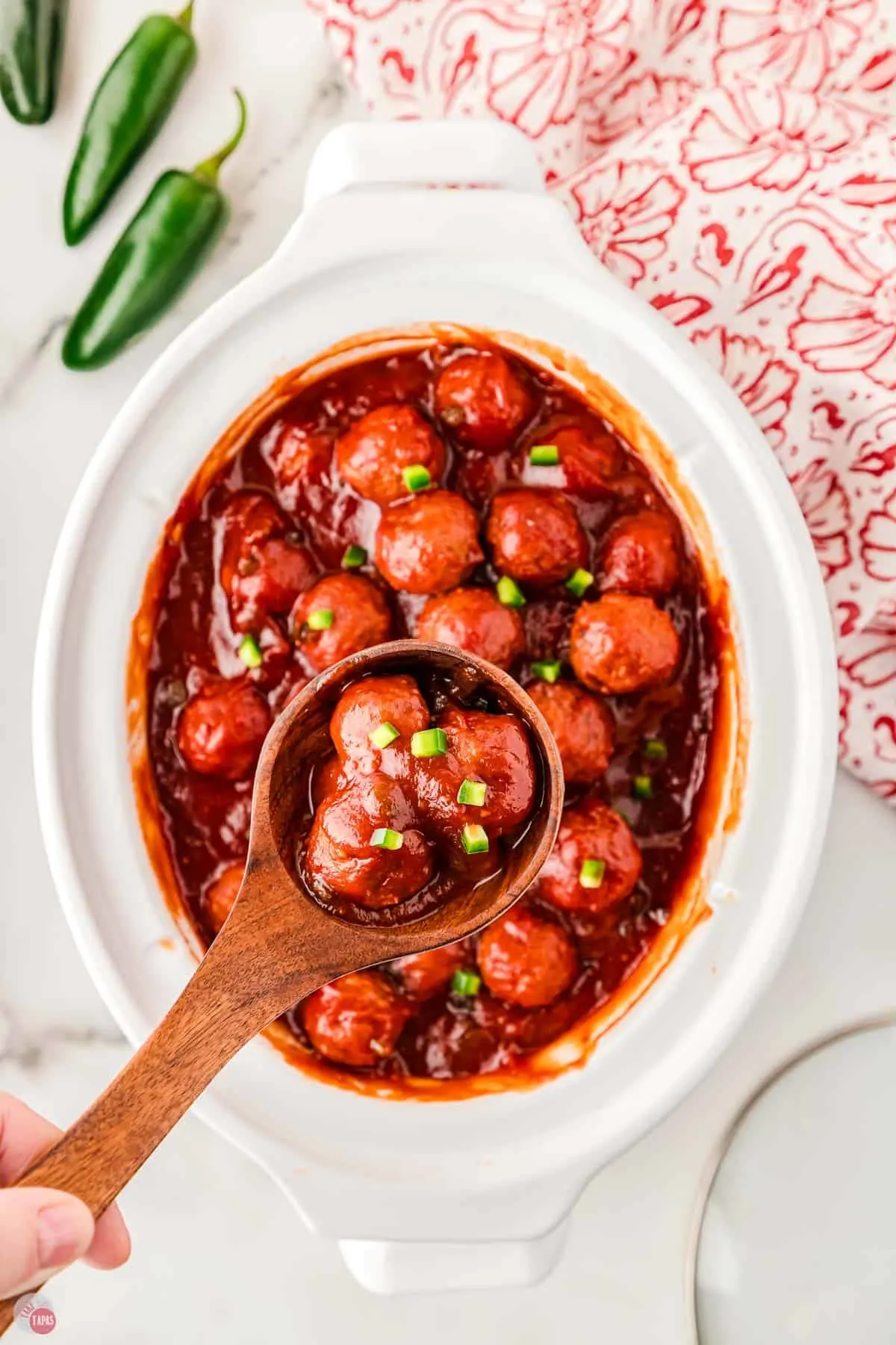 crock pot cranberry meatballs in a white bowl