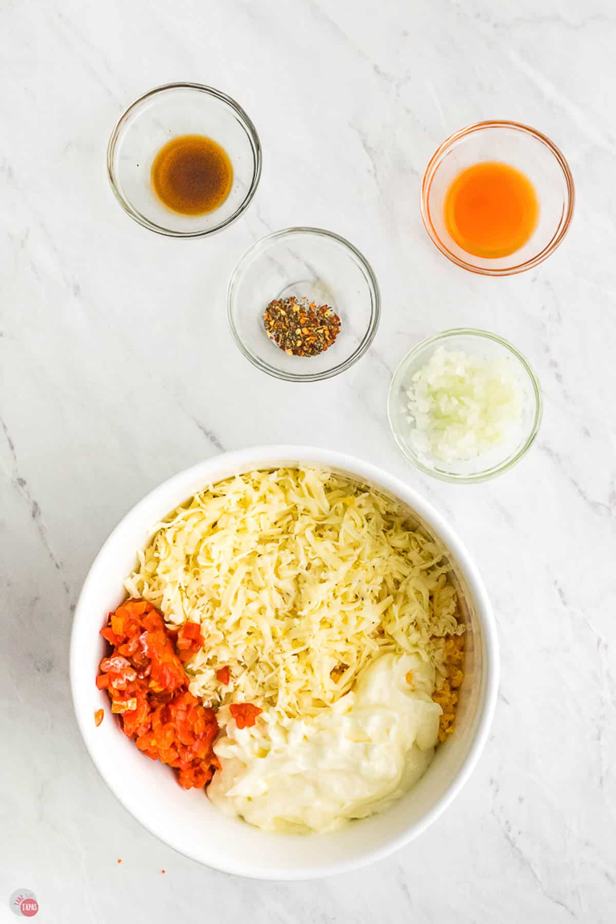 cheese and pimentos in a bowl