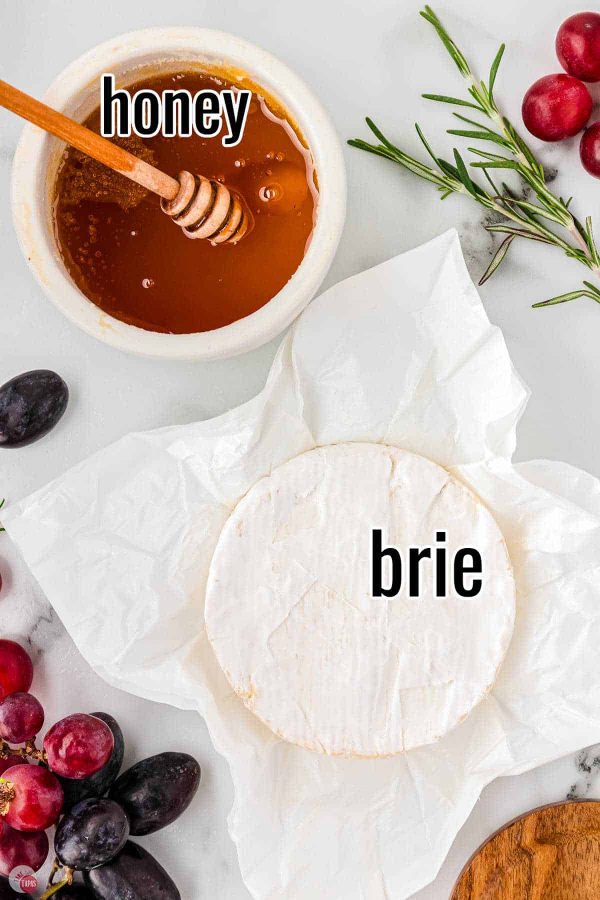 brie wheel with dish of honey