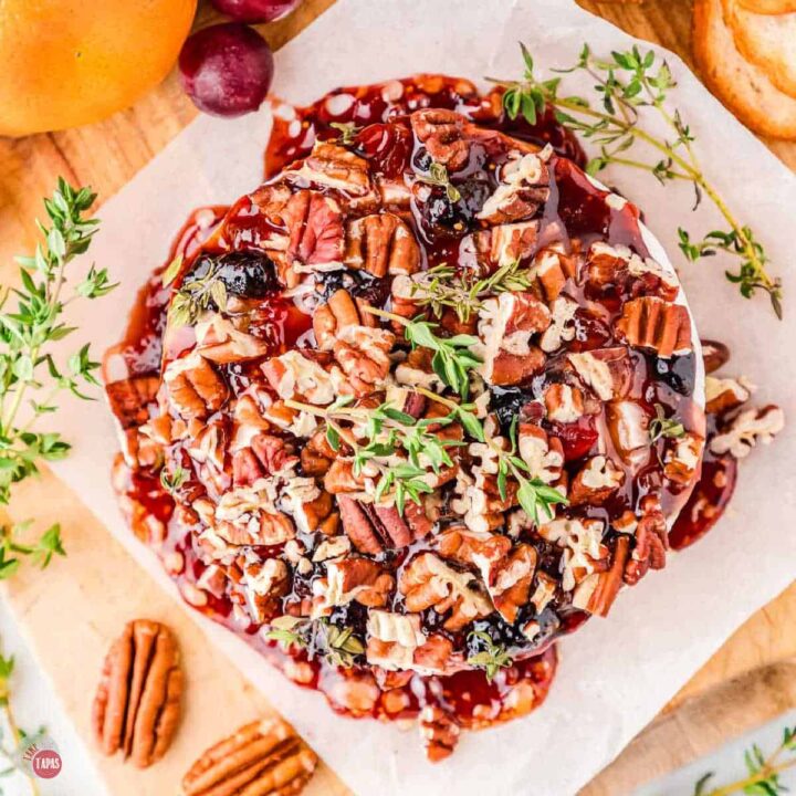 baked brie with jam and topped with toasted pecans