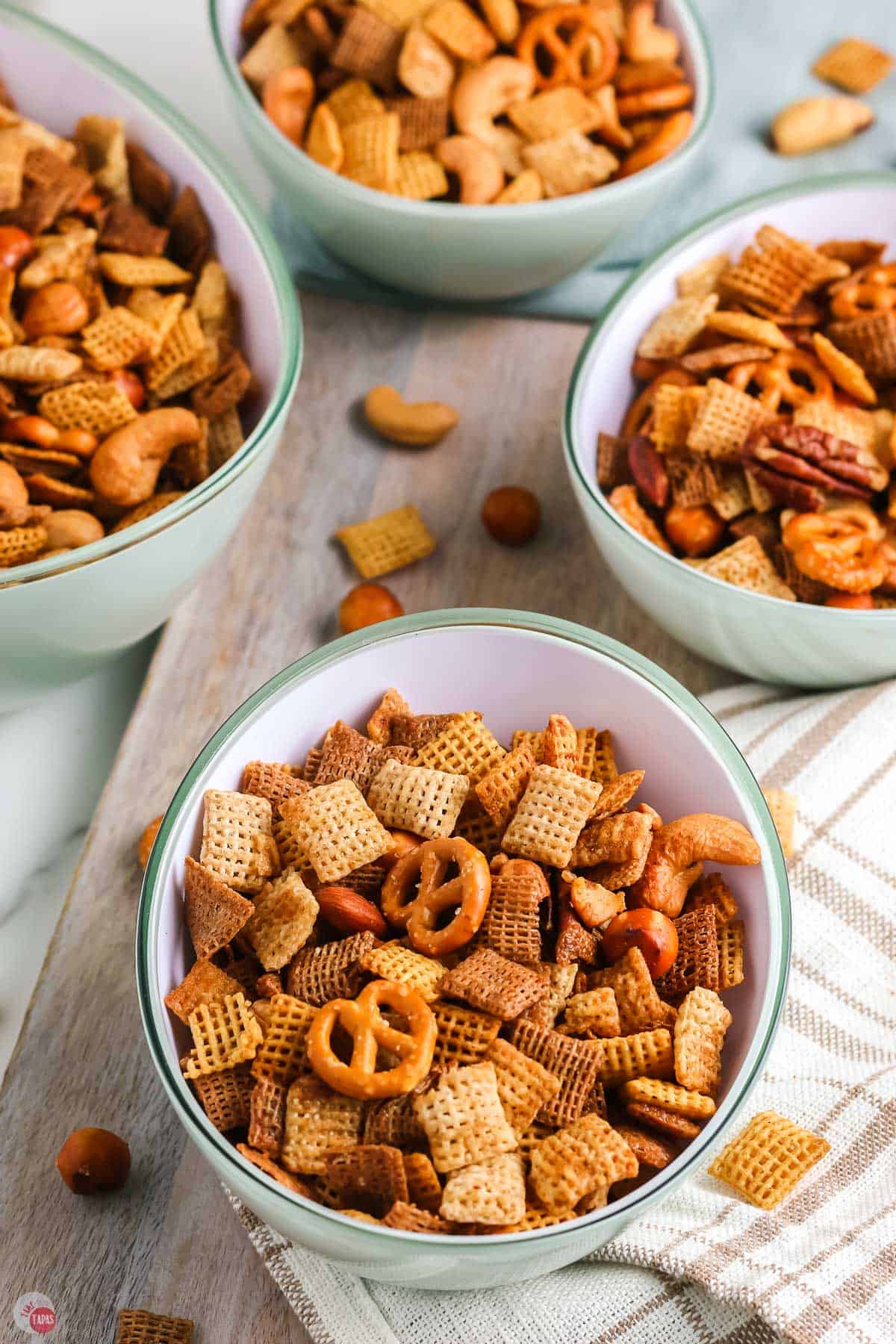 three bowls of oven baked chex mix