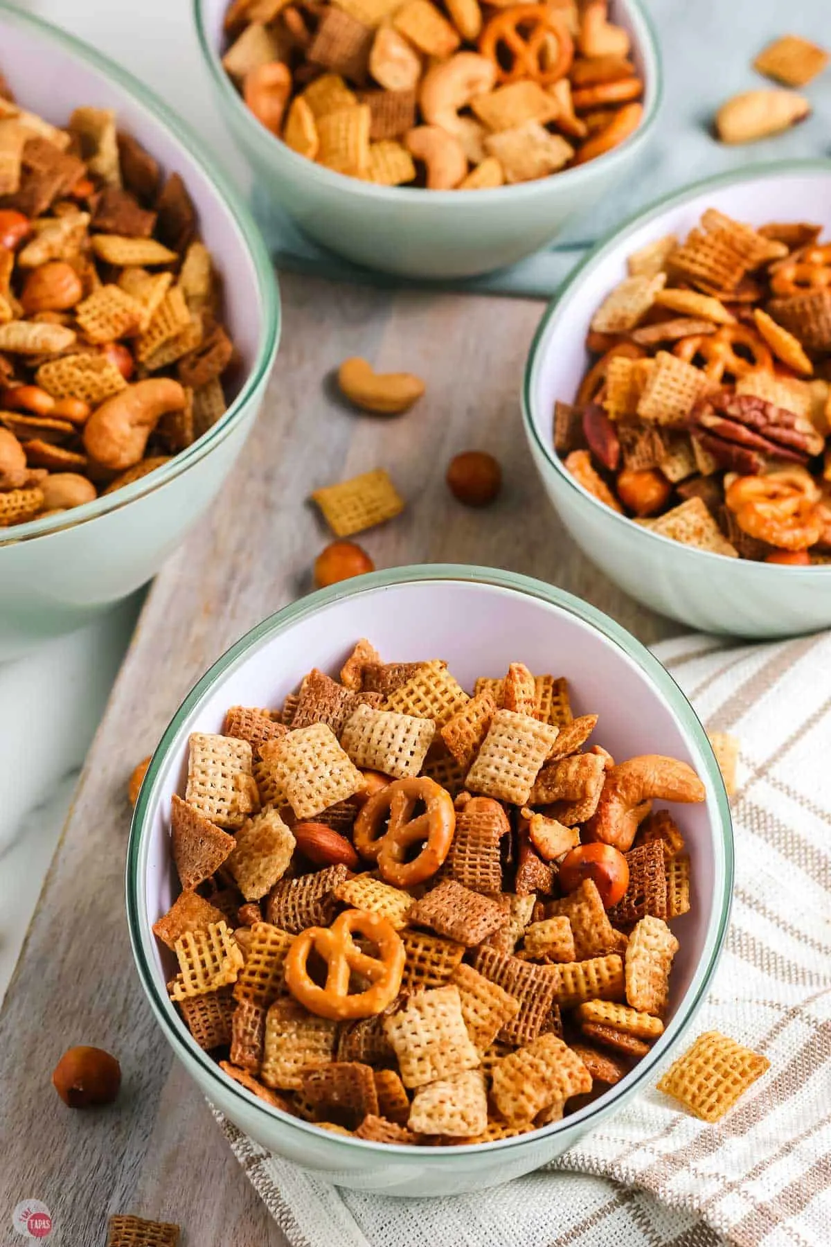 three bowls of oven baked chex mix