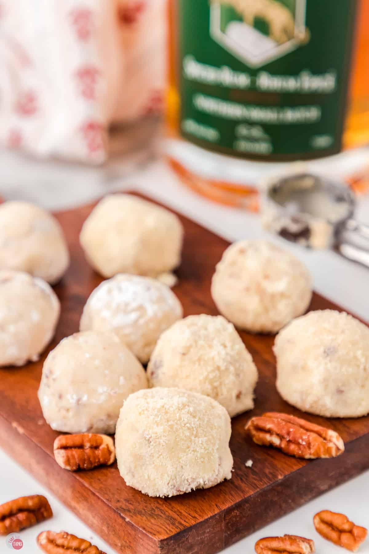 plate of rum balls with pecans