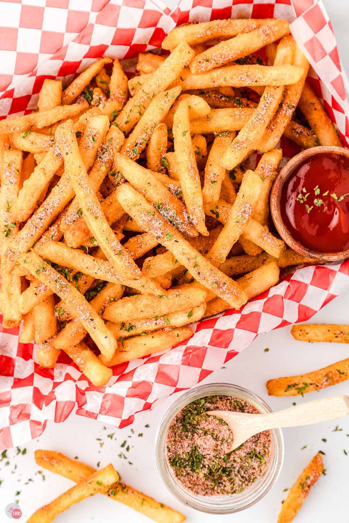 basked of fries with ketchup and mustard