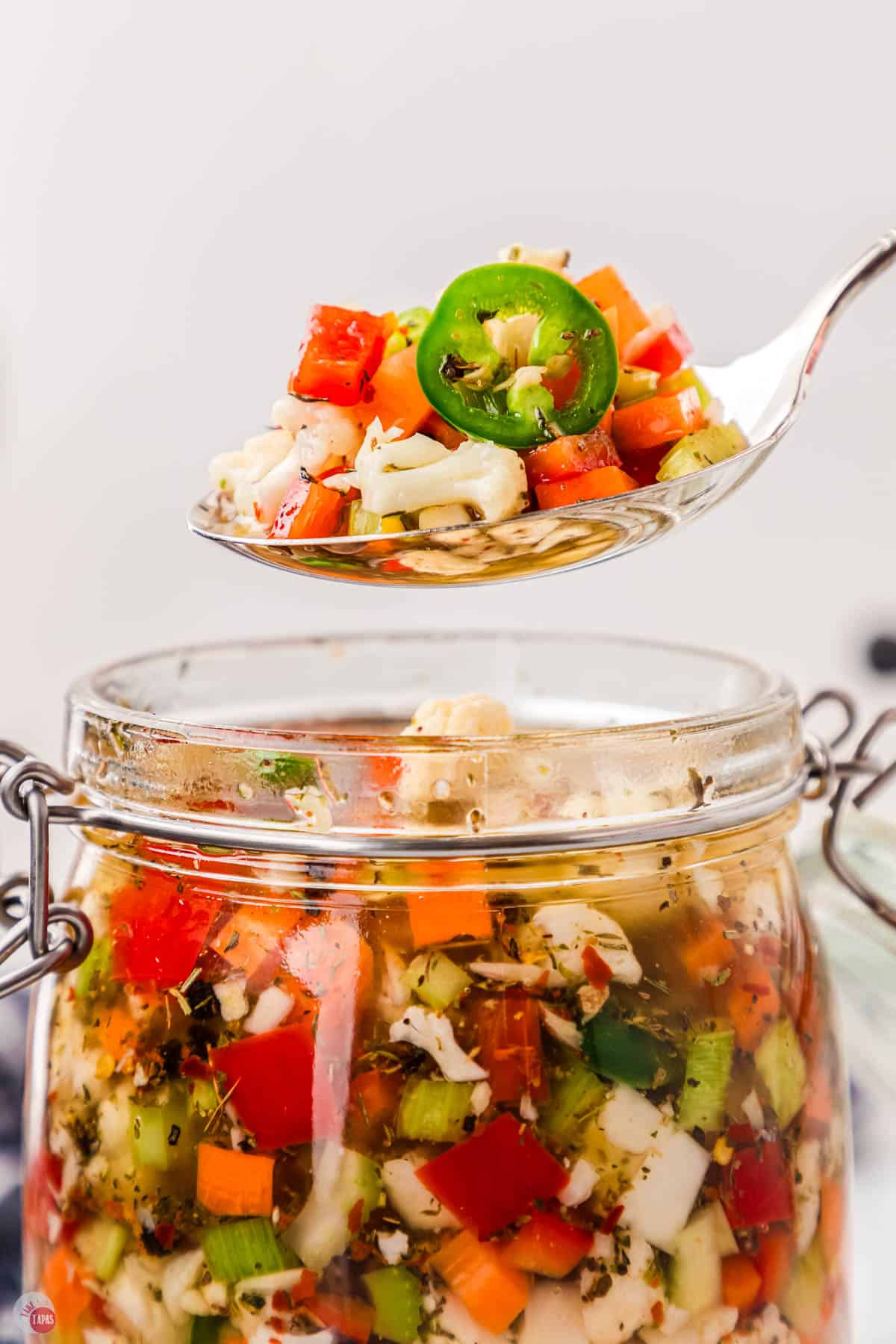 clear jar of giardiniera vegetable relish