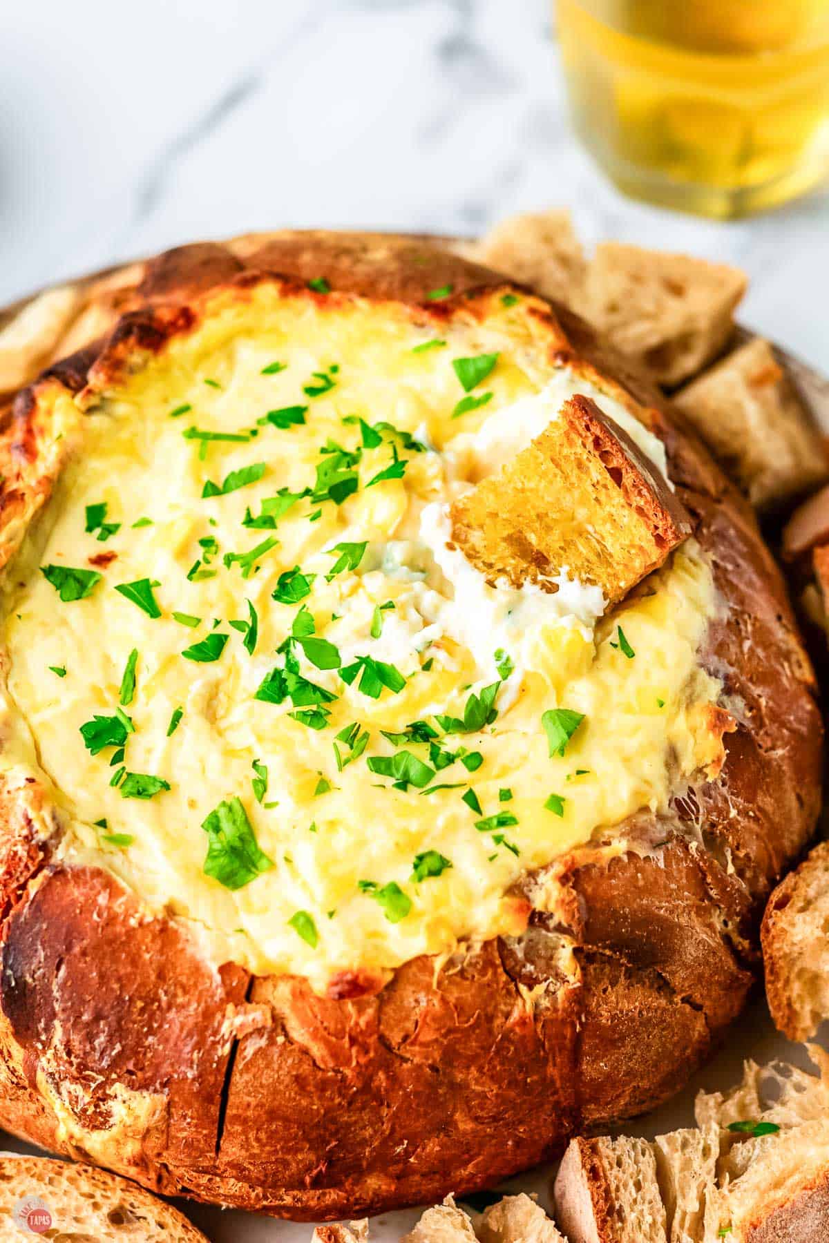 beer cheese dip in a crusty bread boule