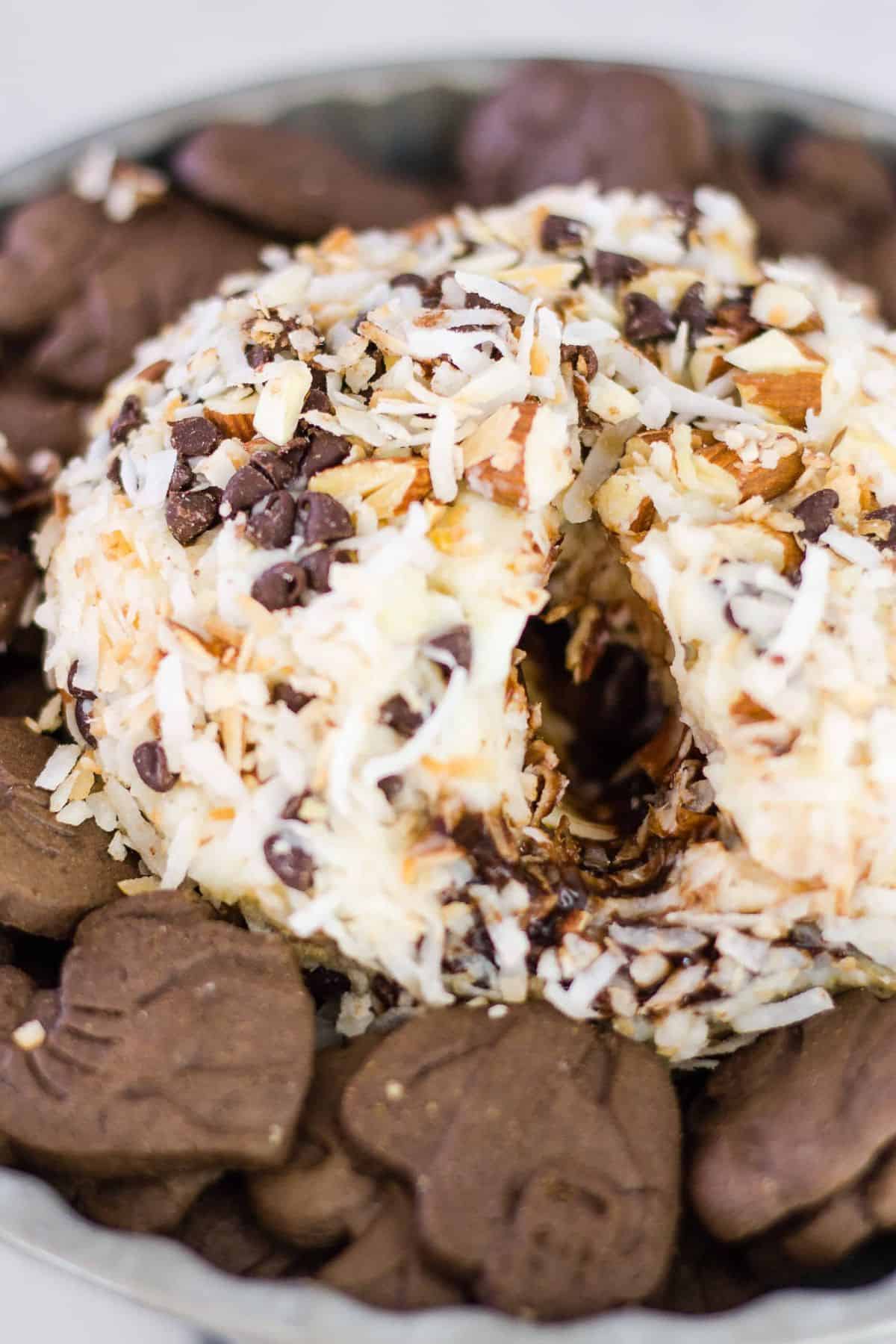 dessert cheese ball with hole in it to show the fudge sauce inside