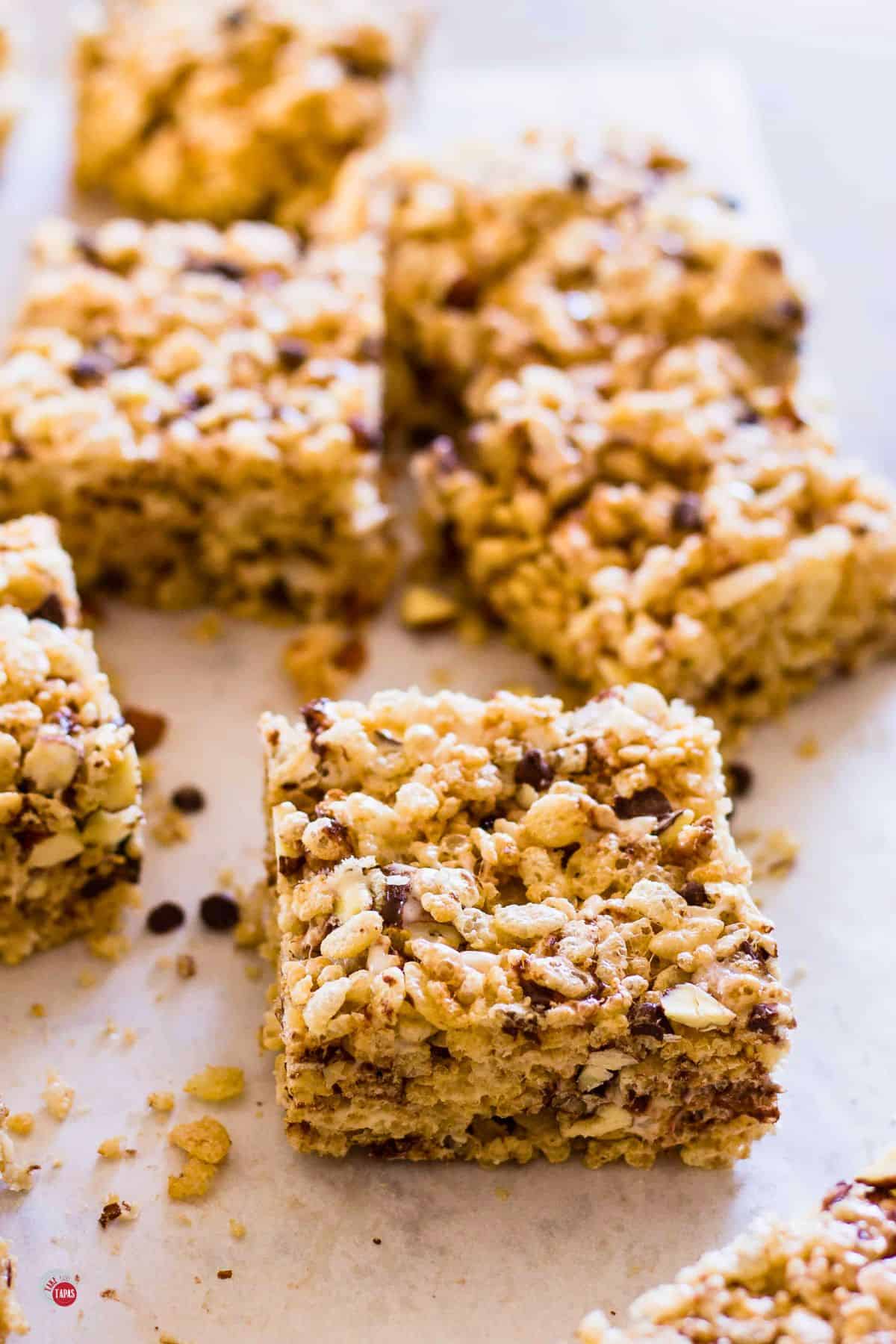 close up of marshmallow cereal treats on parchment paper