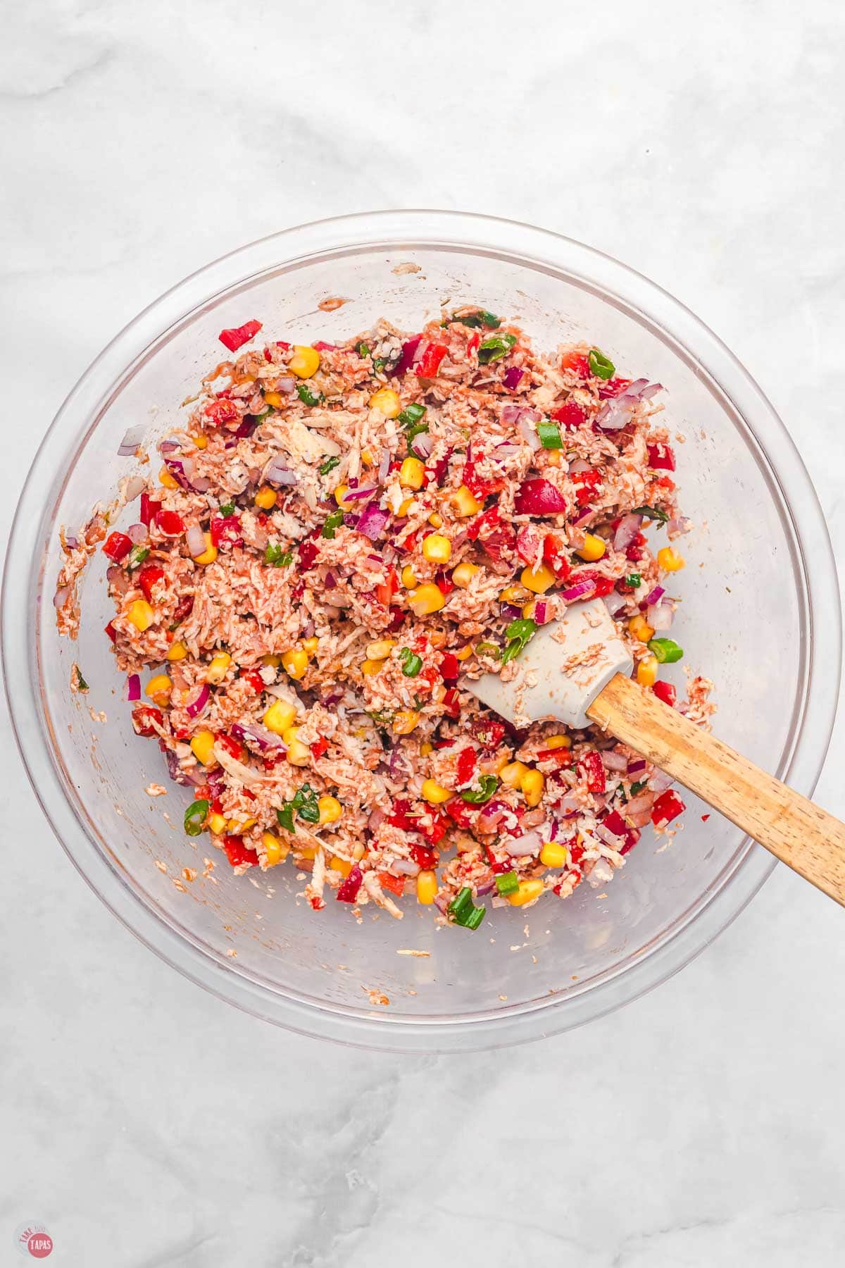 quesadilla mixture in a blear bowl with a spatula