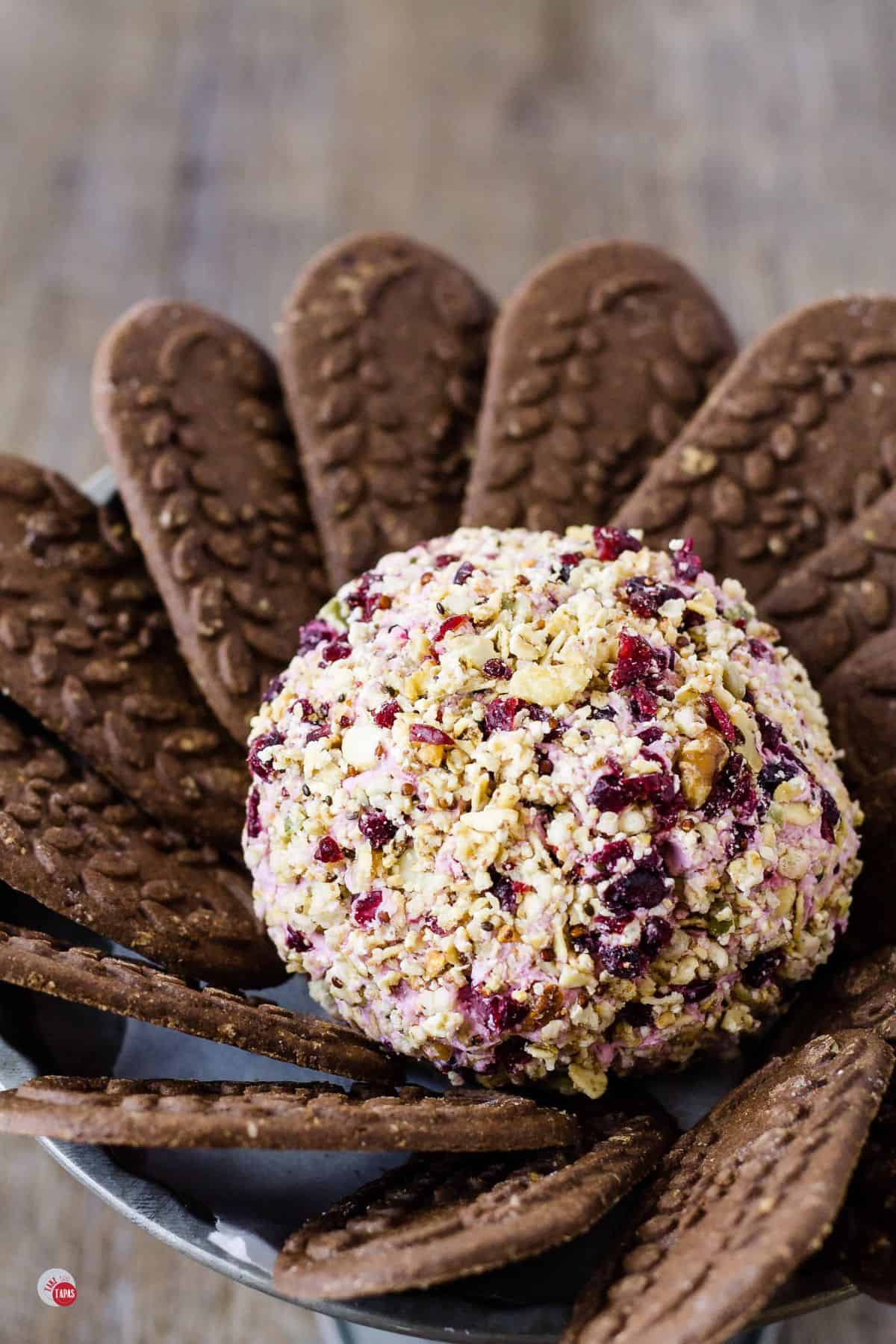 brunch cheese ball with chocolate breakfast wafers around it
