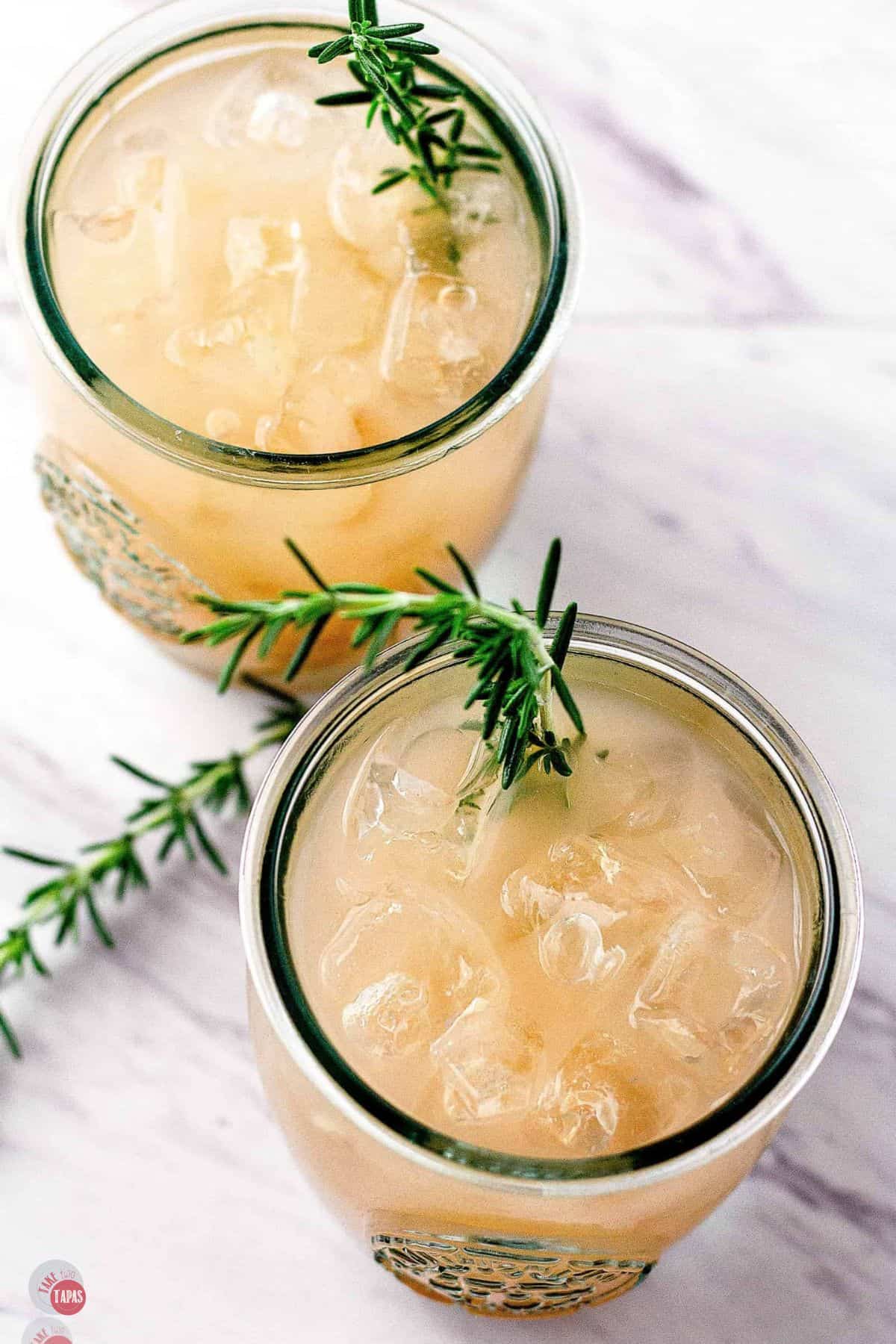 overhead picture of two drinks with fresh thyme