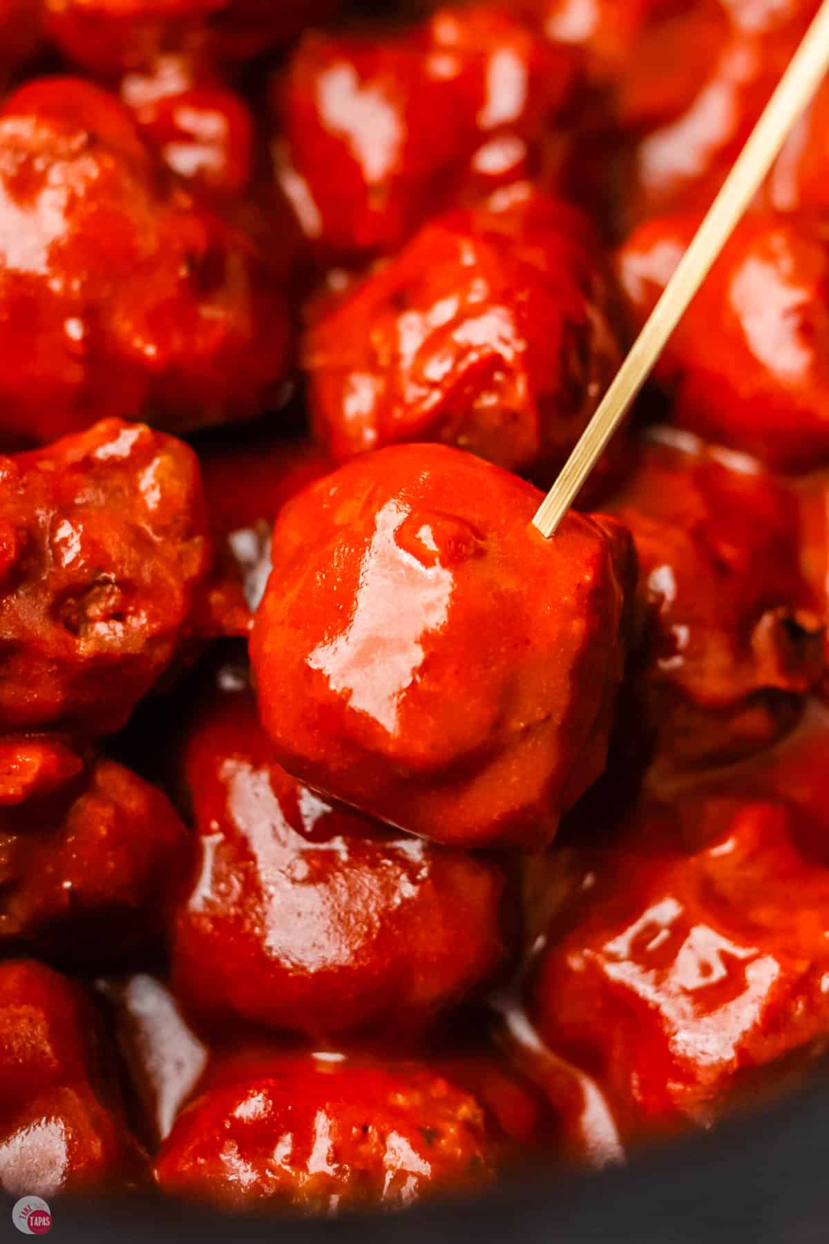 close up of a cocktail meatball with a toothpick in it