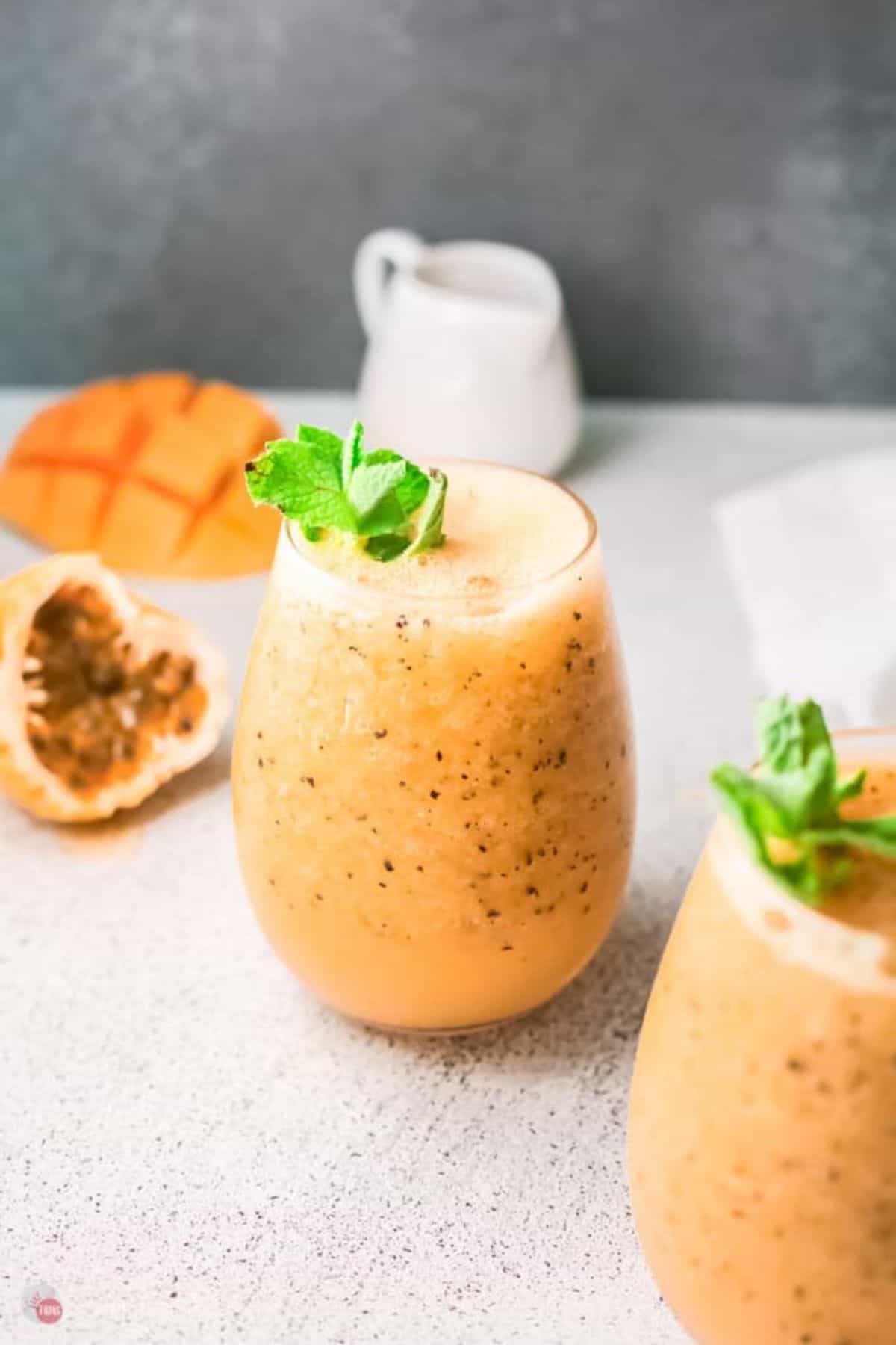 two glasses of mango passionfruit wine slushies
