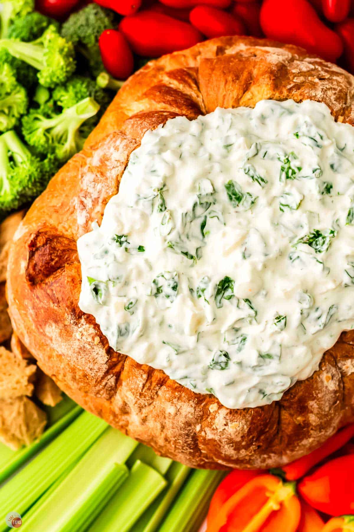 ranch spinach dip in a loaf of bread