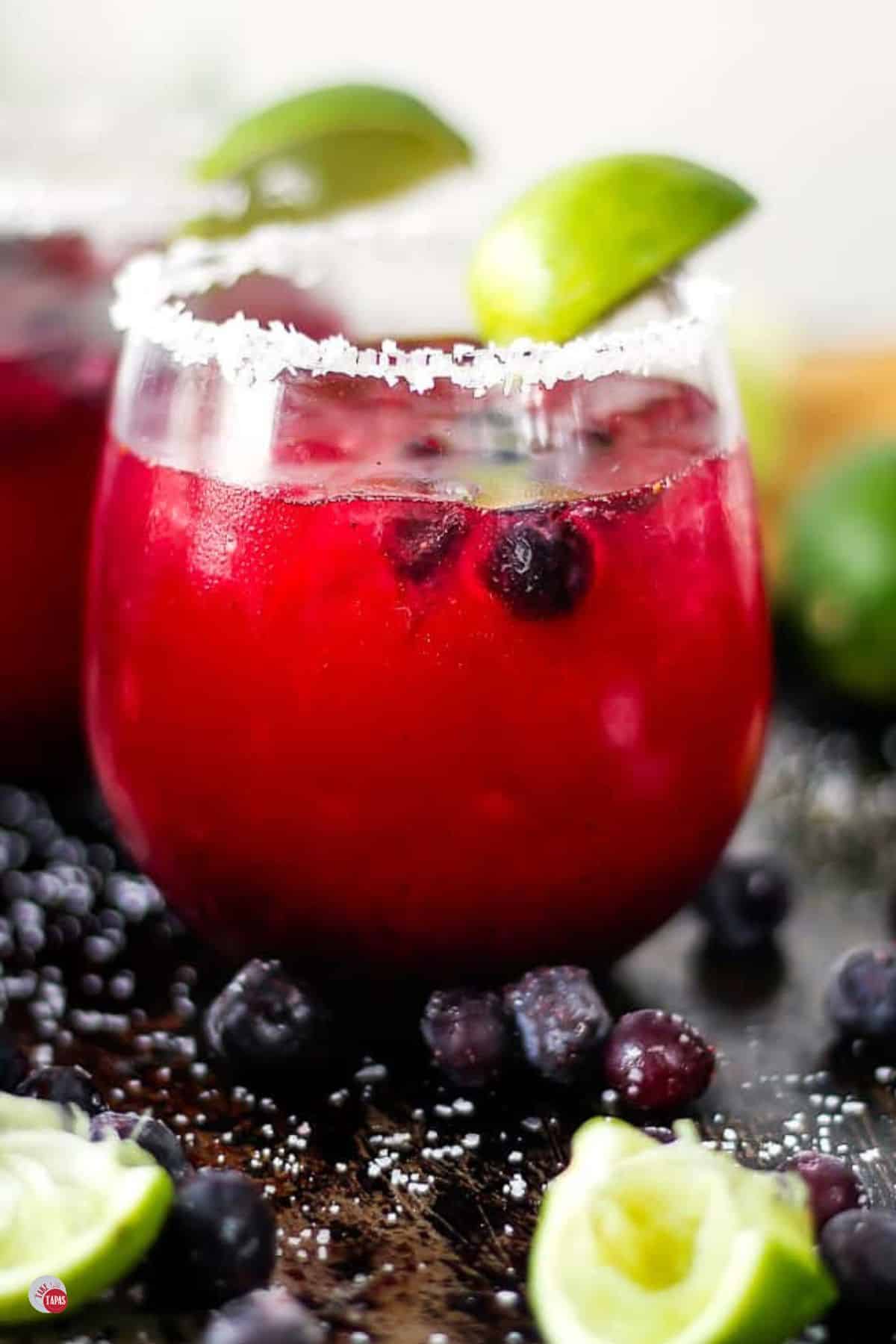 side view of a margarita with blueberries