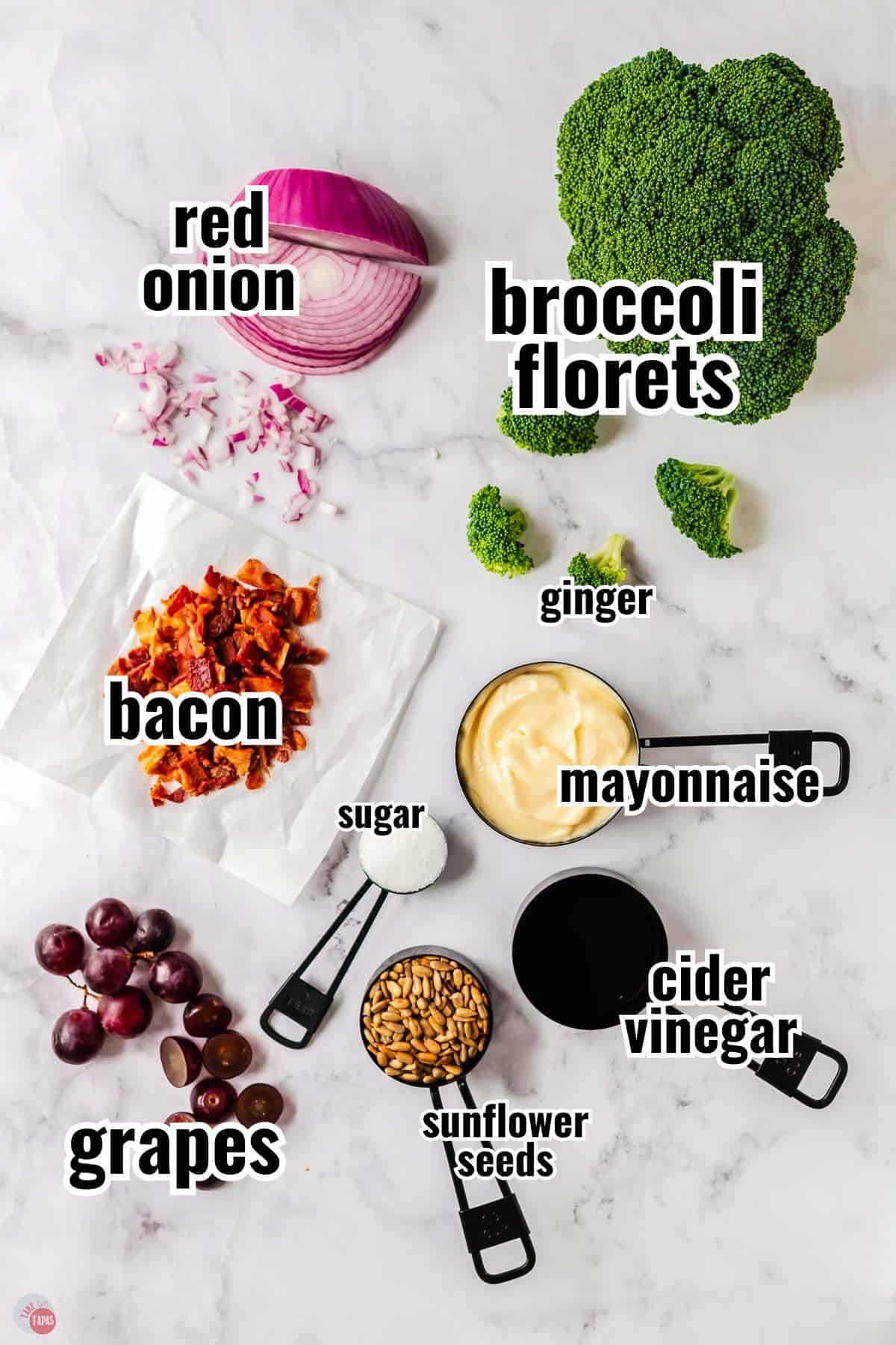 ingredients for a salad recipe in individual containers with text overlay labeling them