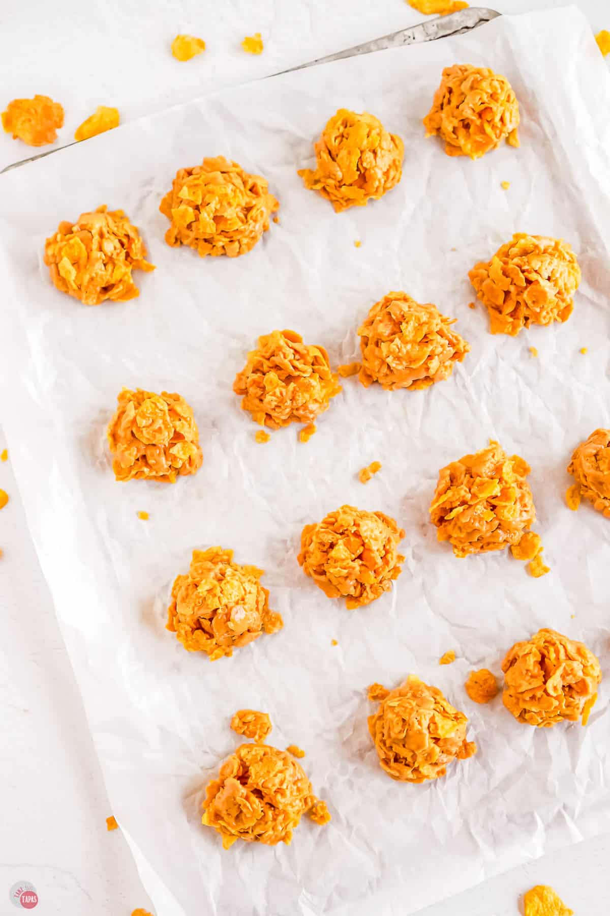 baking sheet with parchment paper with mounds of candy on it