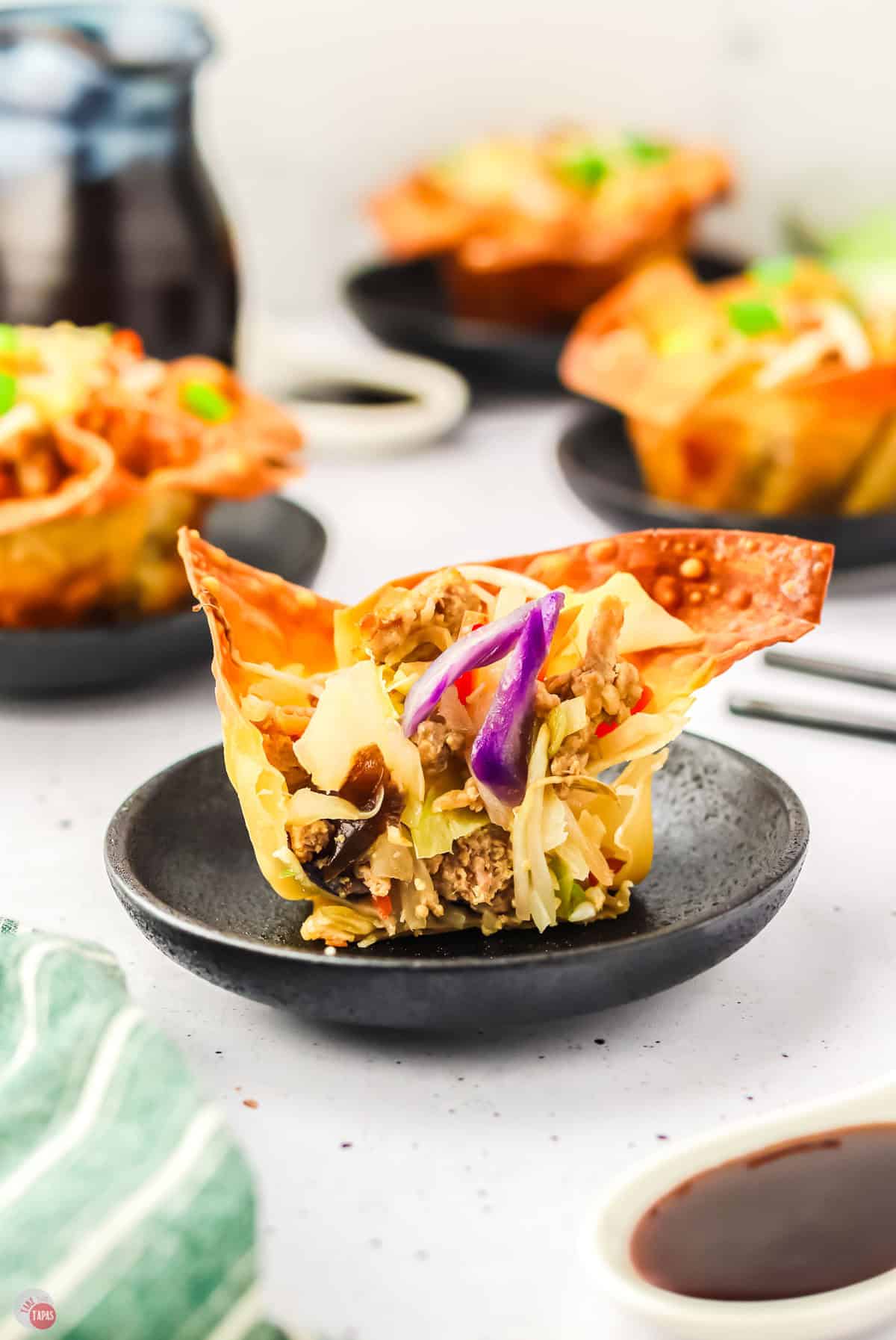 close up of wonton cup cut in half with cabbage mixture inside