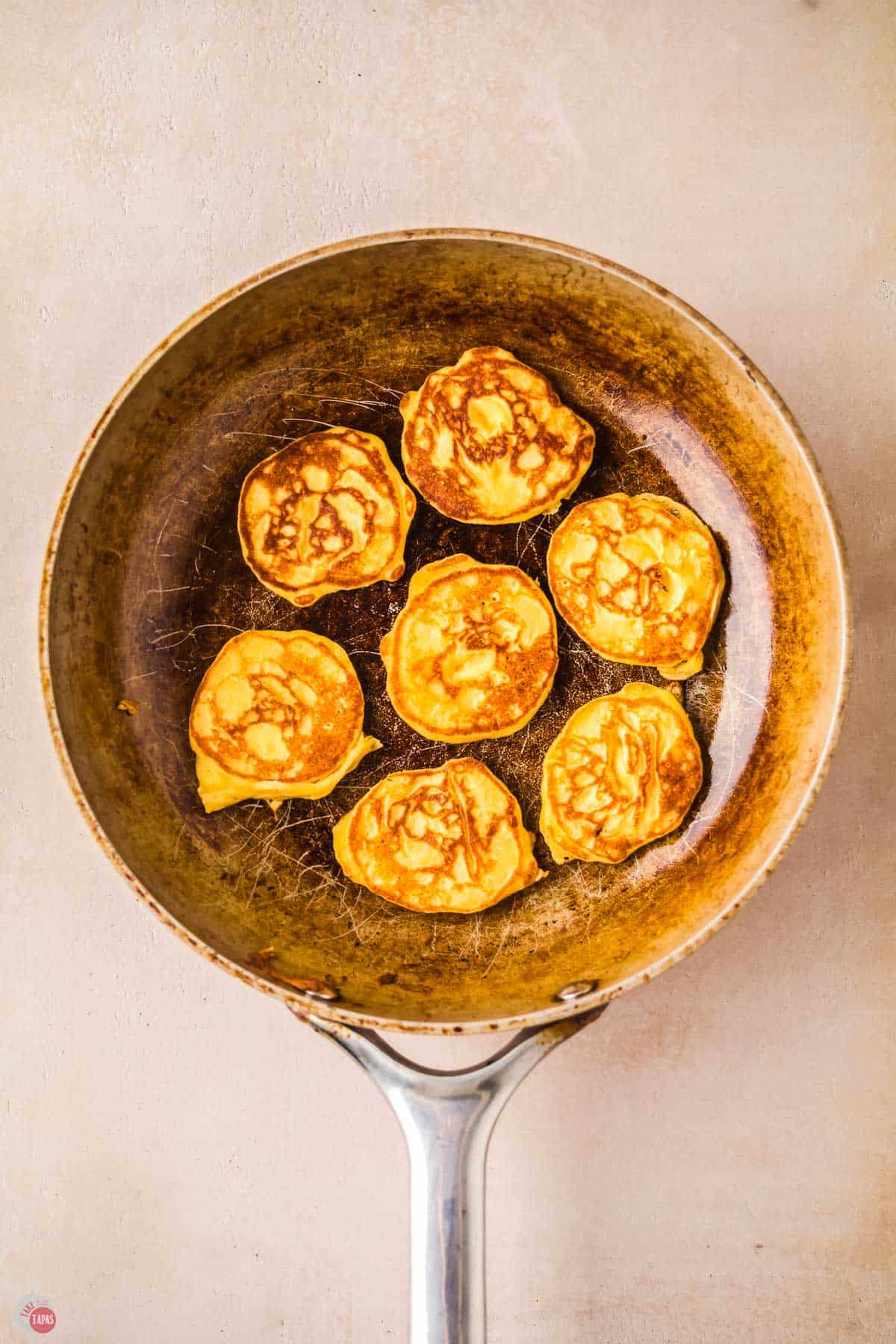 mini pancakes in a skillet