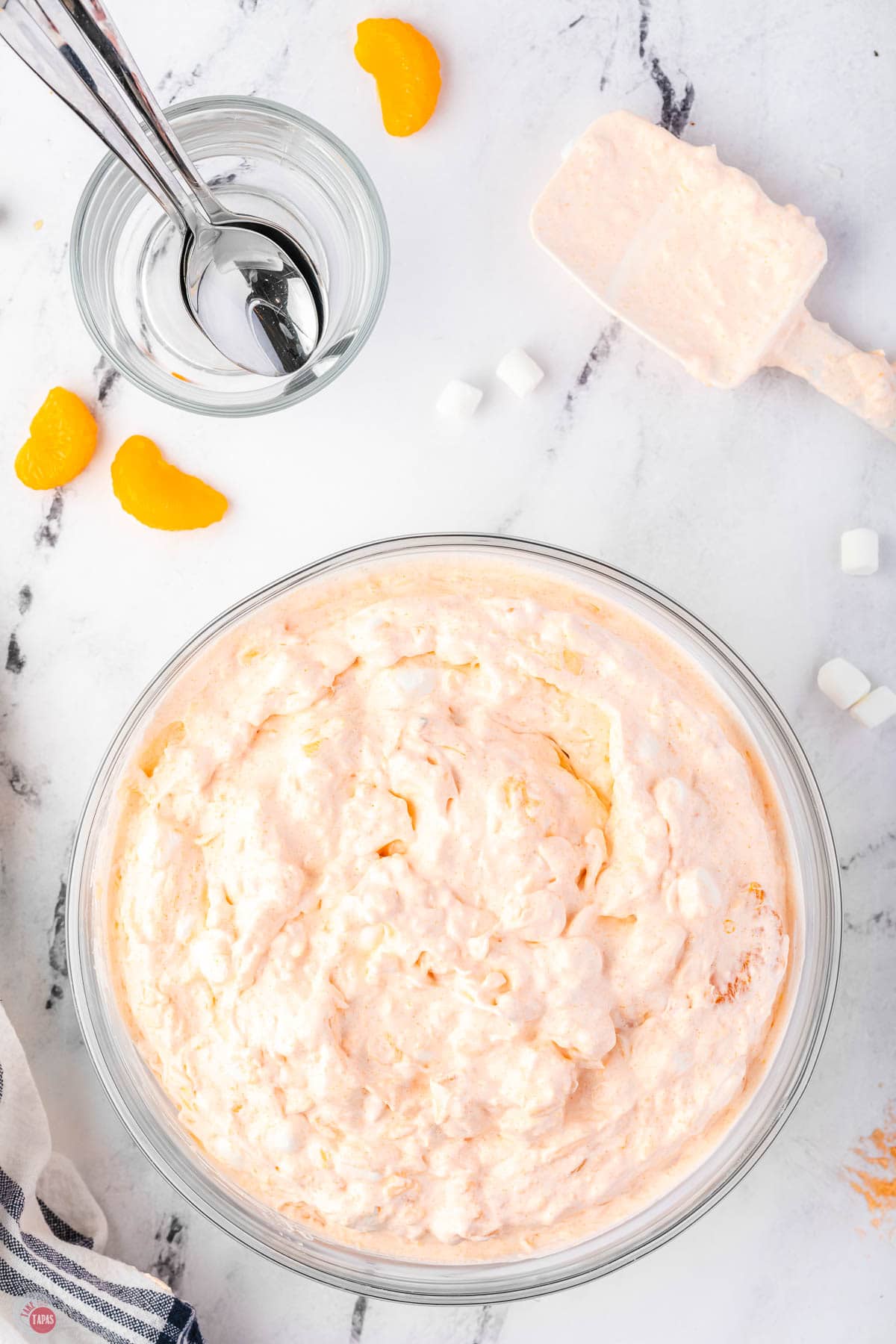 orange fluff jello salad in a bowl