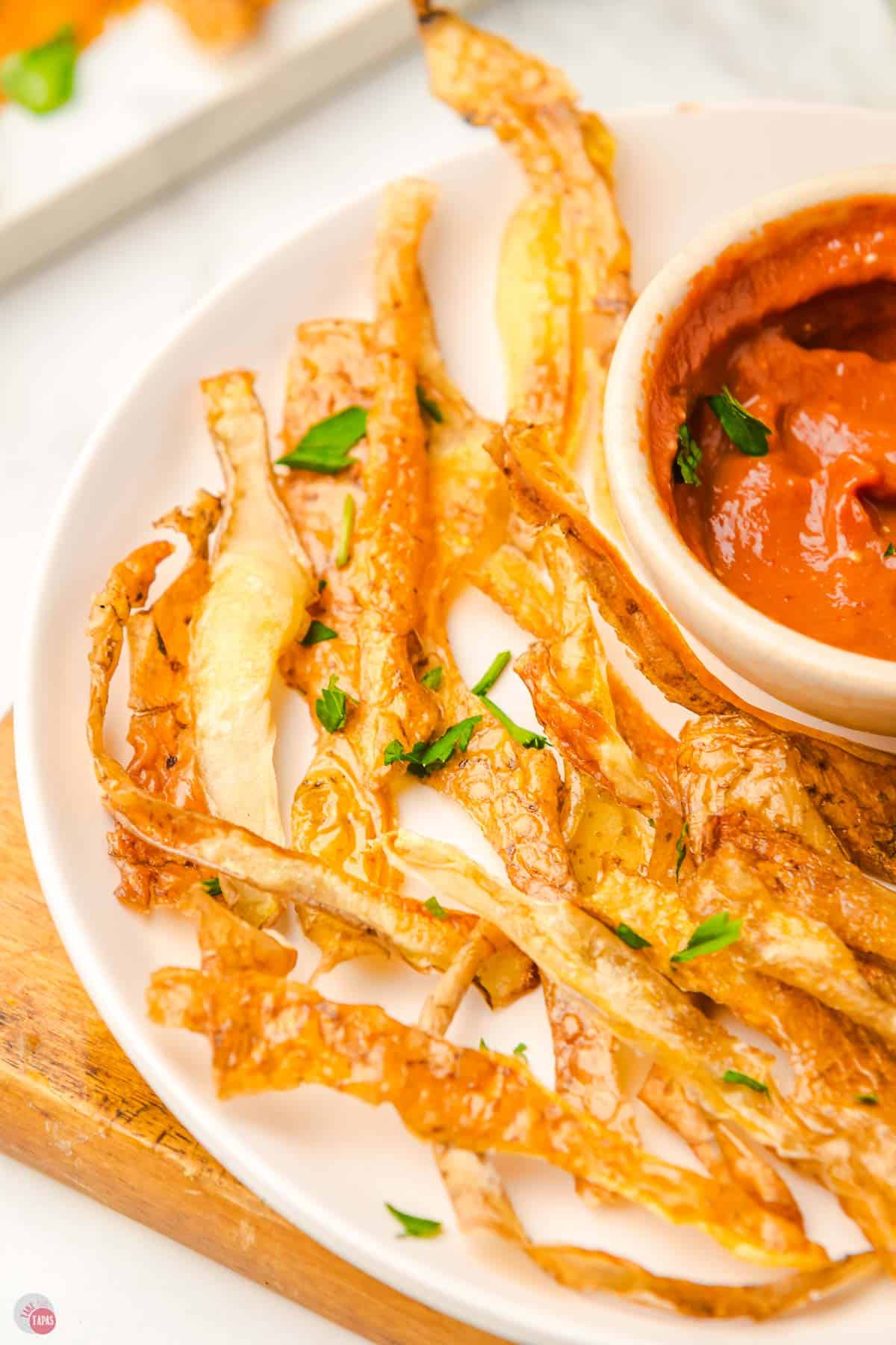 close up of potato skin chips on a plate