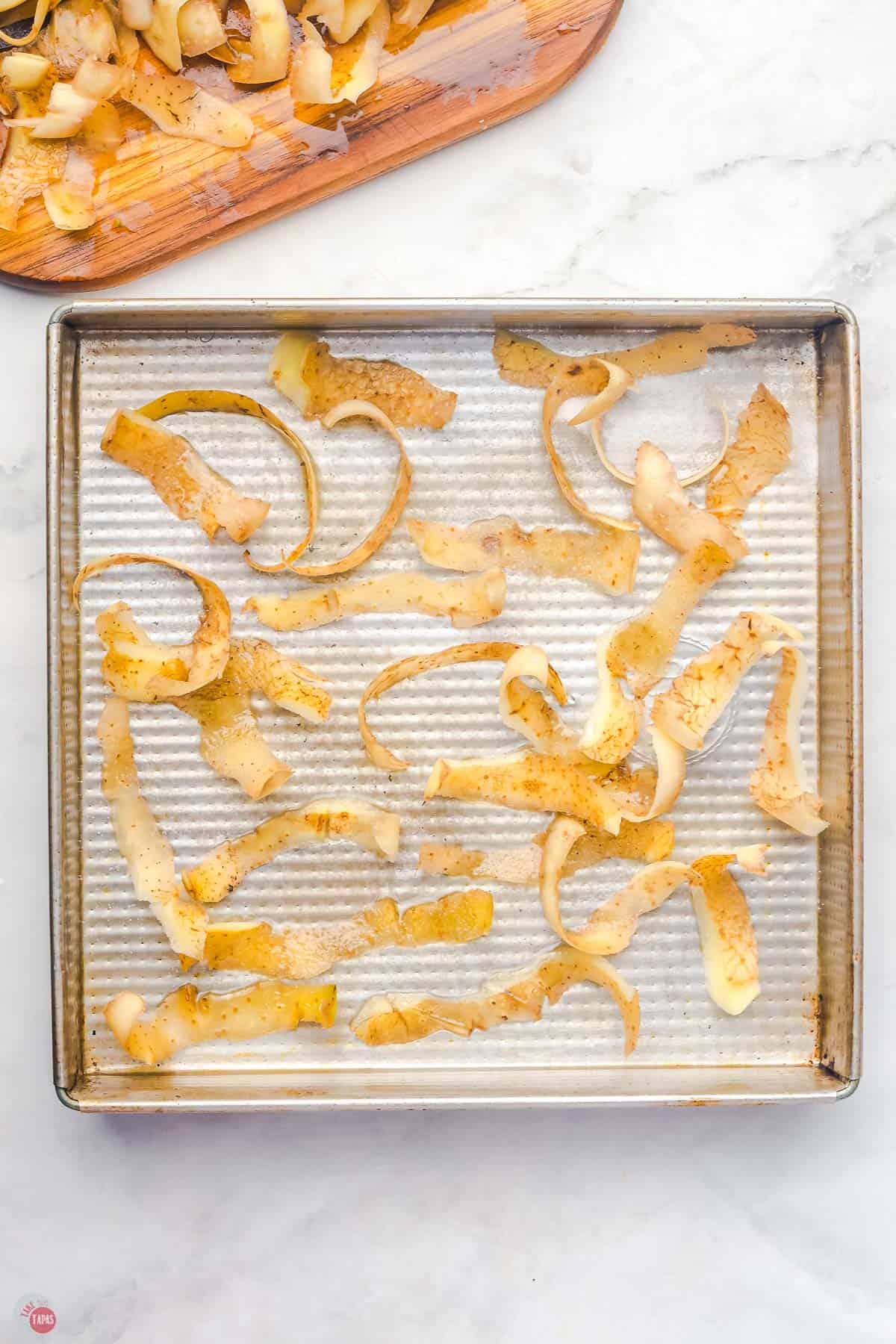 potato peels on a baking sheet