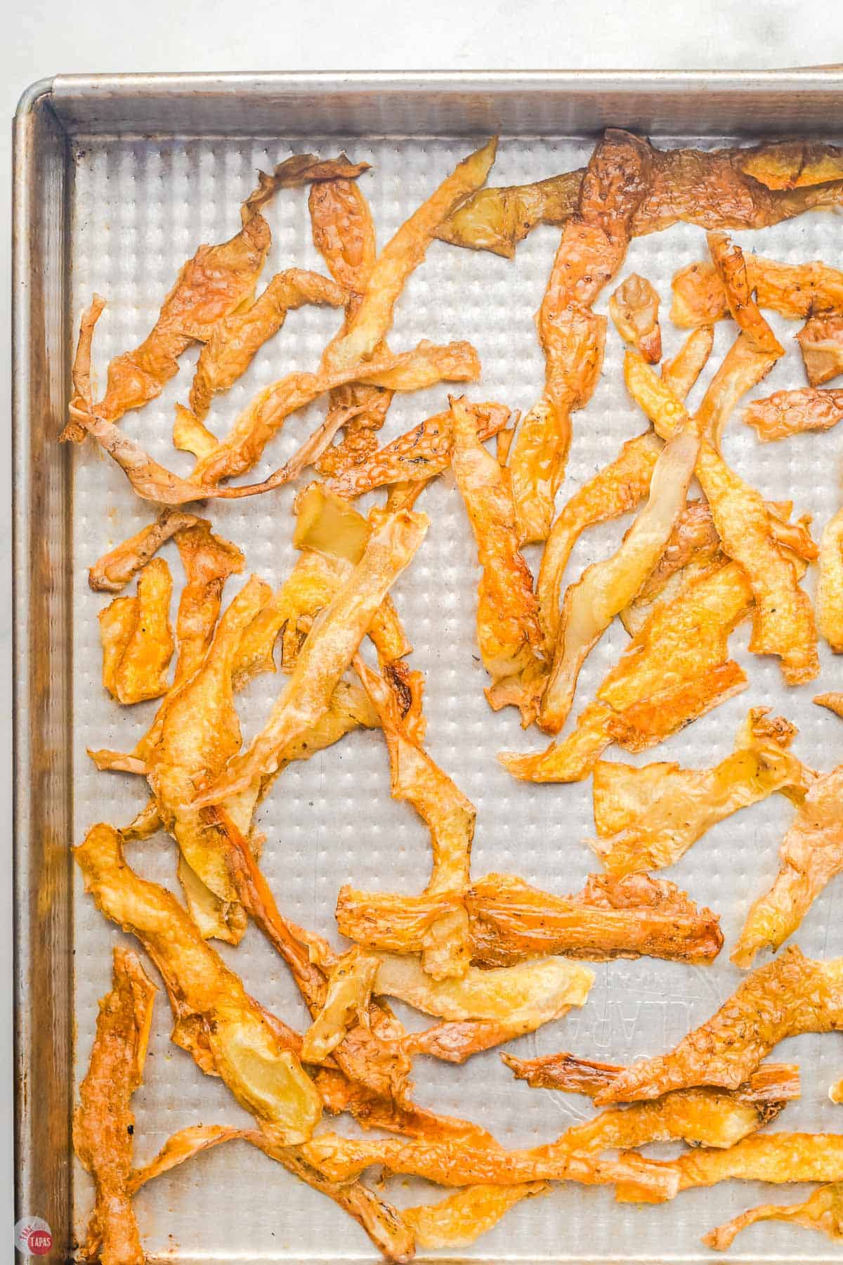 potato skin chips on a baking sheet