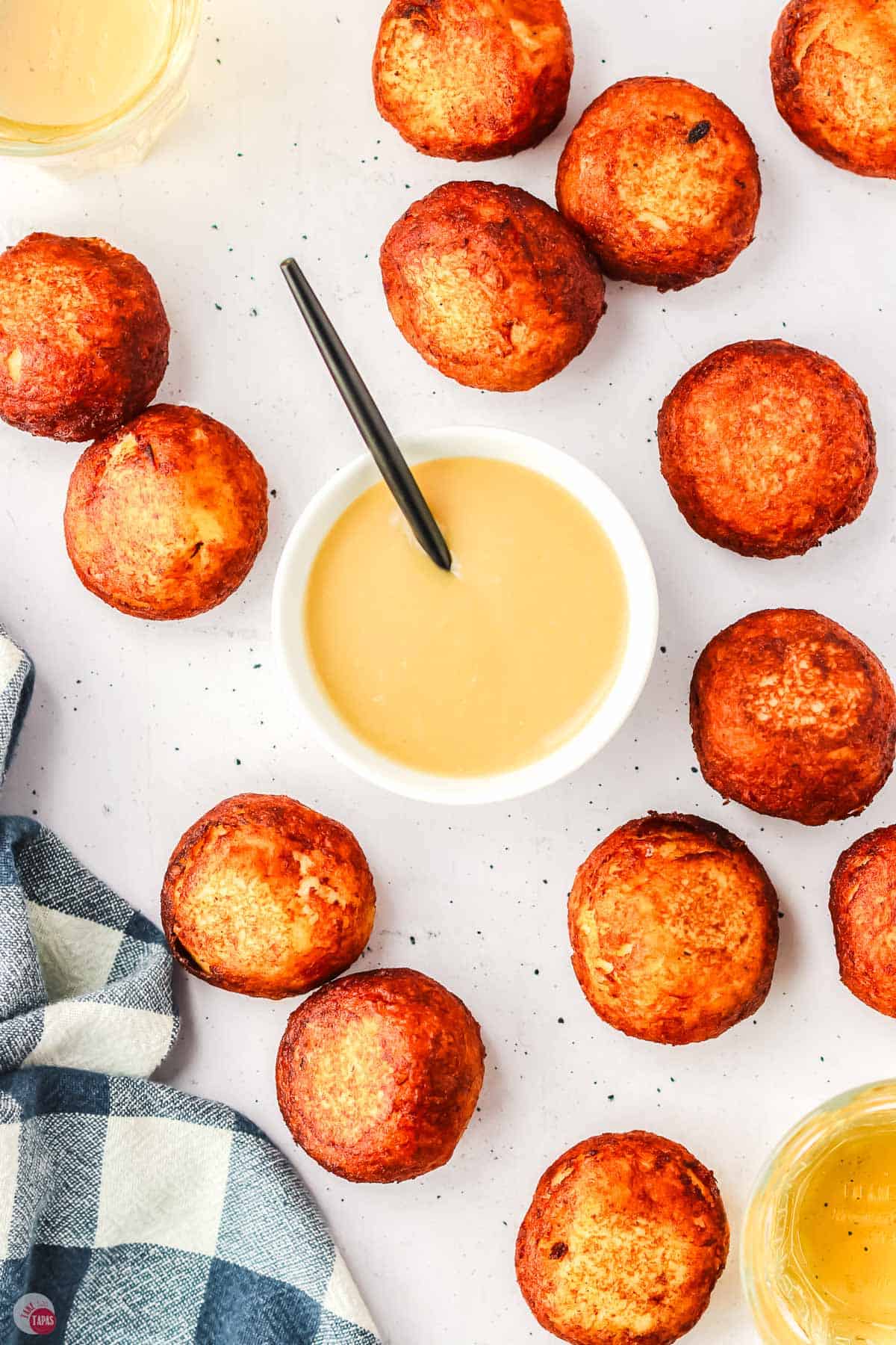 overhead picture of poutine poppers and a bowl of gravy