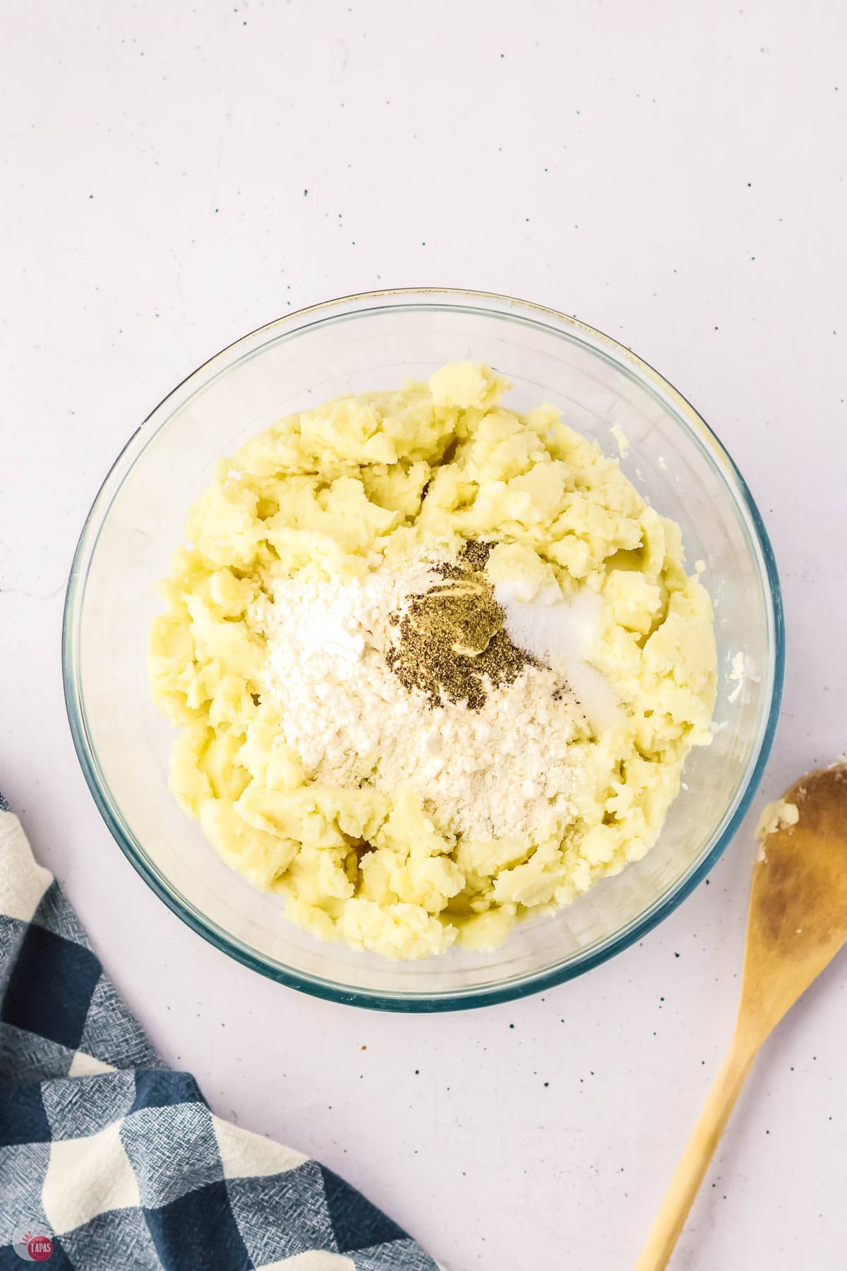 mashed potatoes and flour in a clear bowl