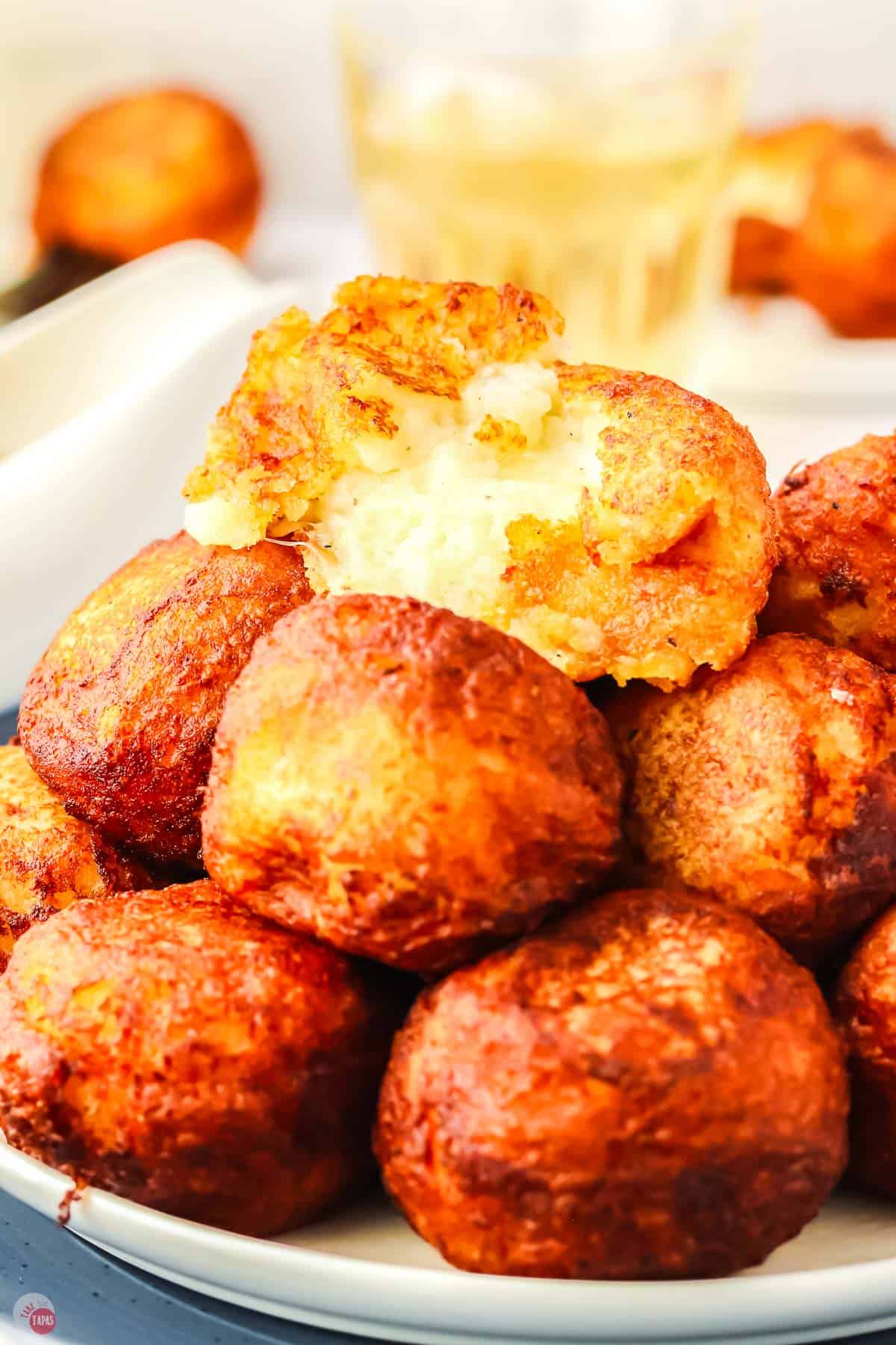 stack of potato poppers with cheese curds