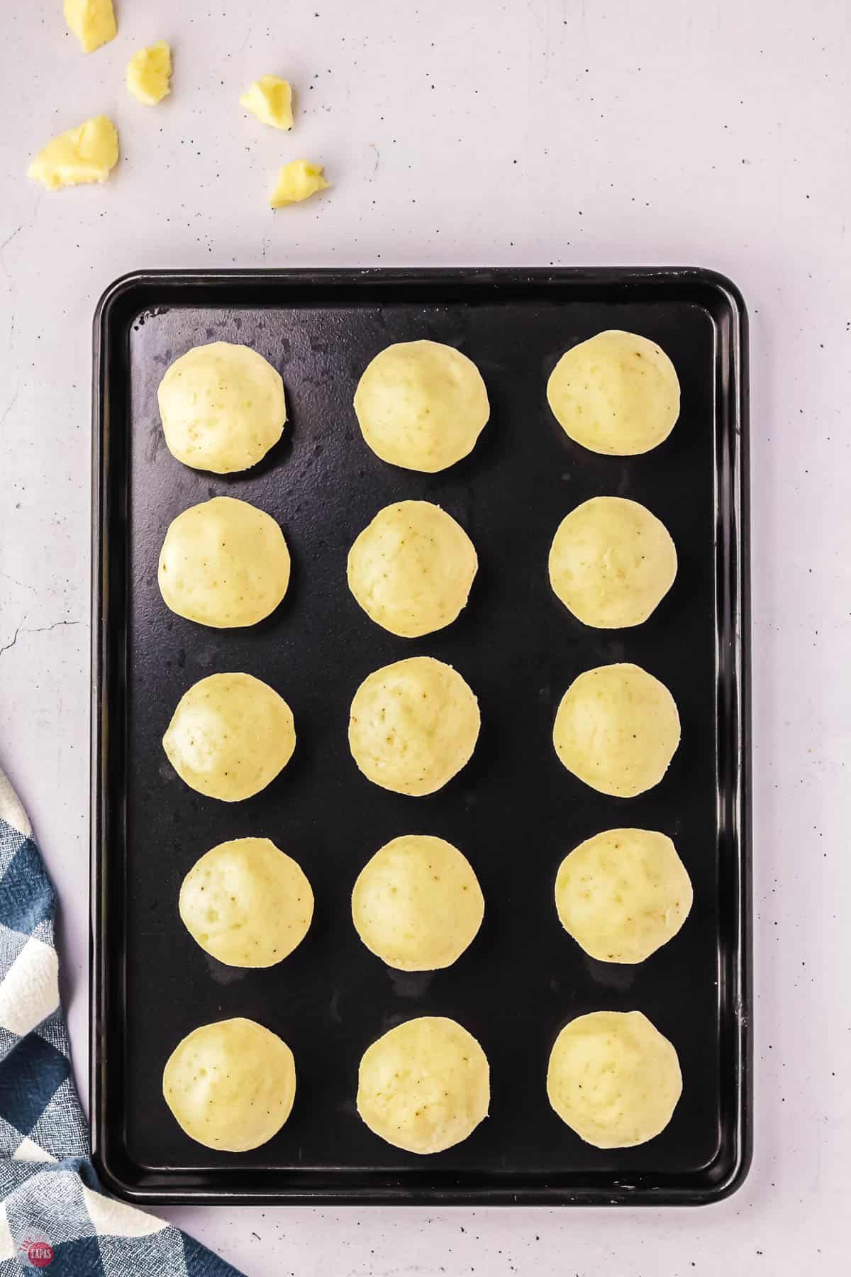 uncooked potato tot poutine on a baking sheet