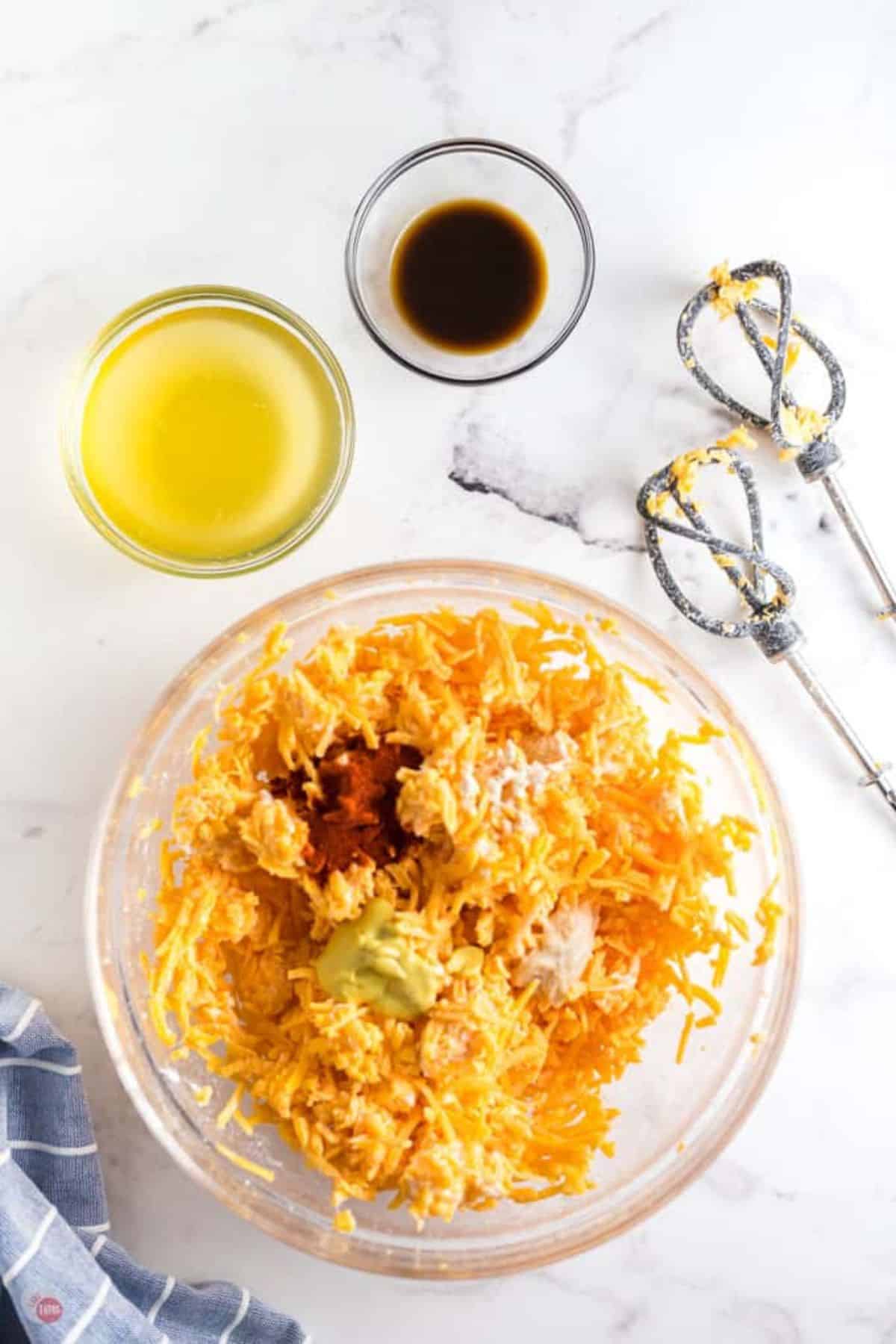 shredded cheese and spices in a clear bowl