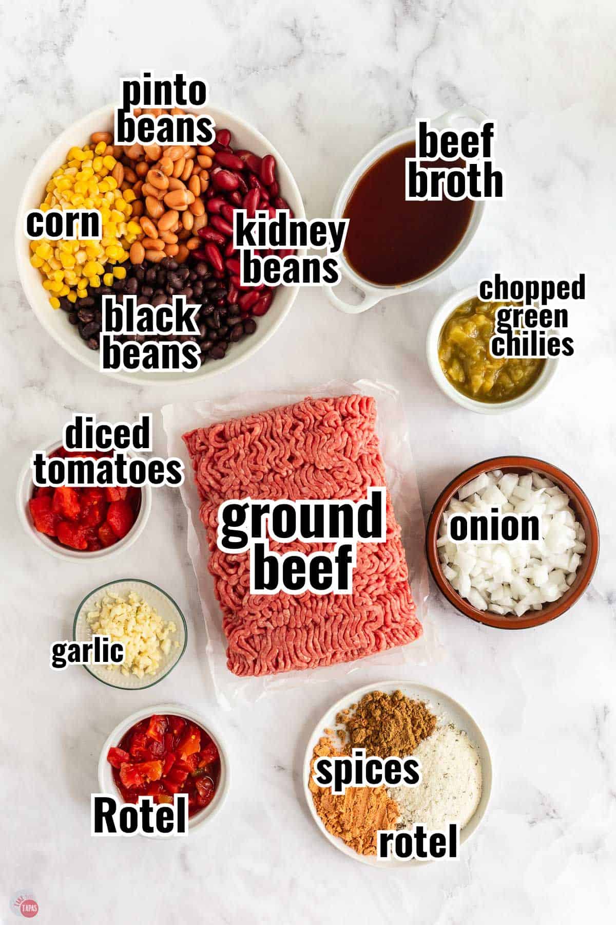 ingredients for a soup recipe in individual bowls with text overlay labeling them