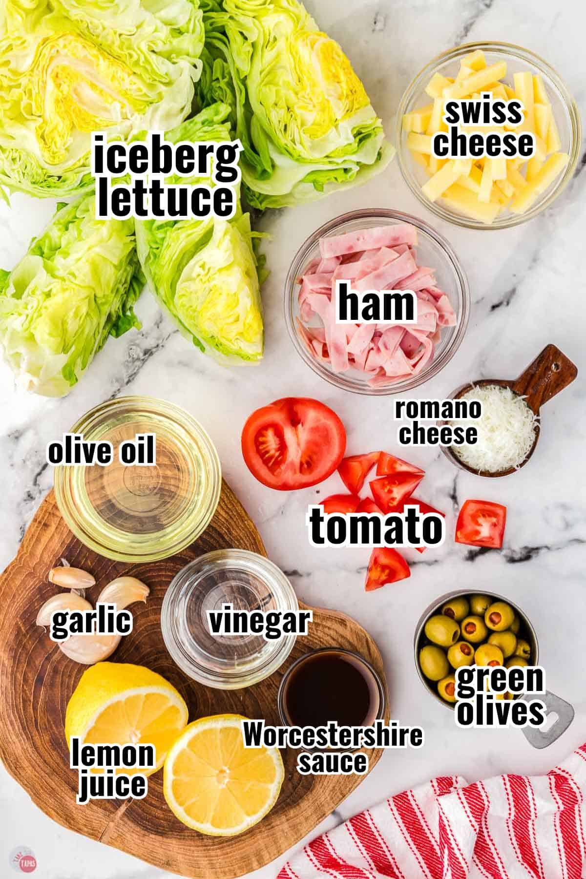 individual ingredients for a salad on a marble counter with text overlay labels