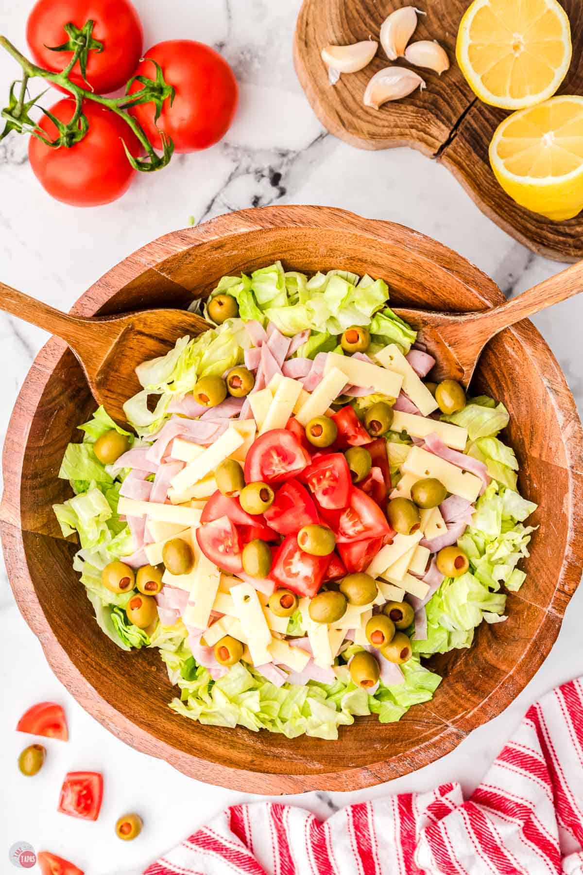 ham and cheese salad in a wood bowl