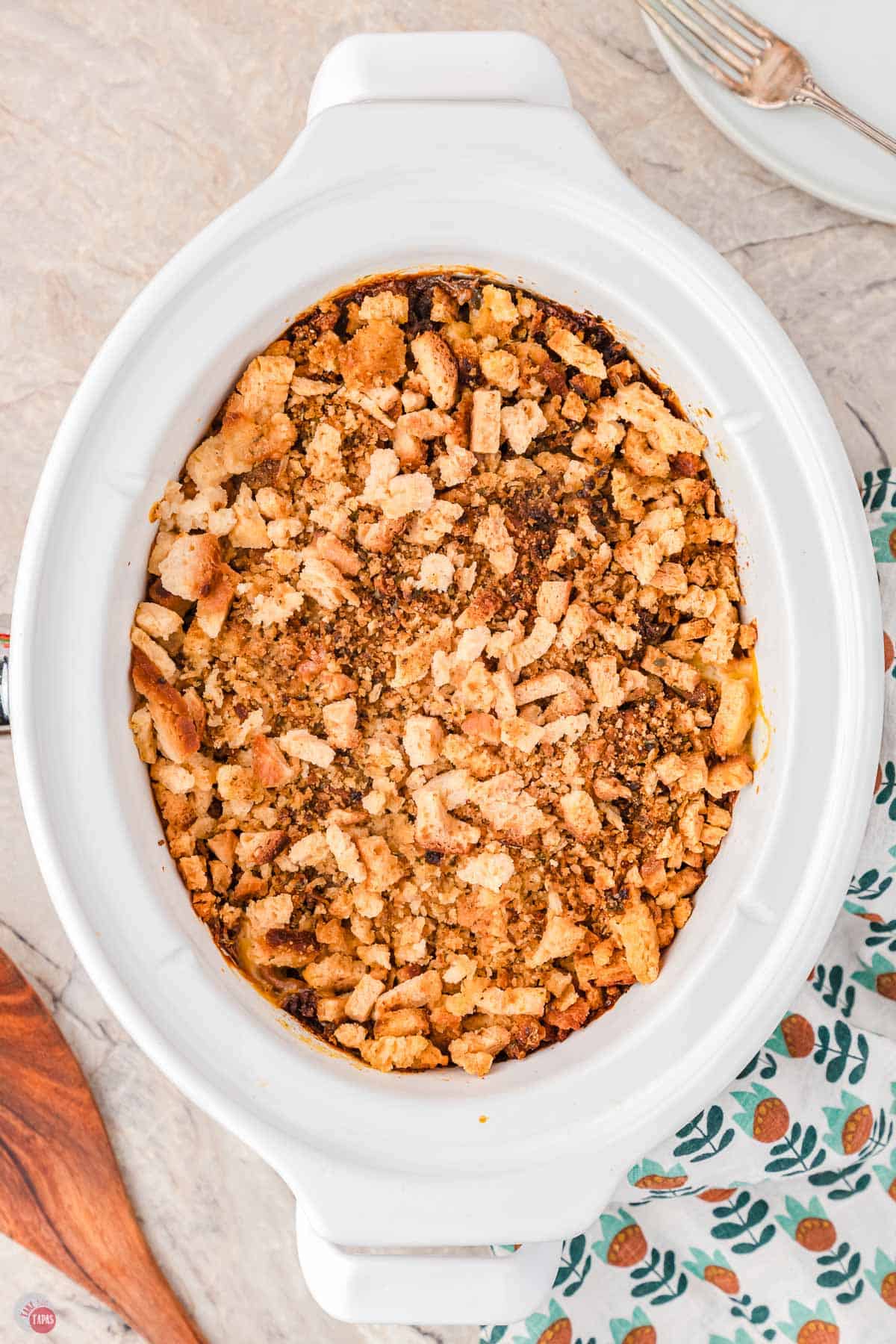 cooked chicken and stuffing casserole in a white slow cooker bowl