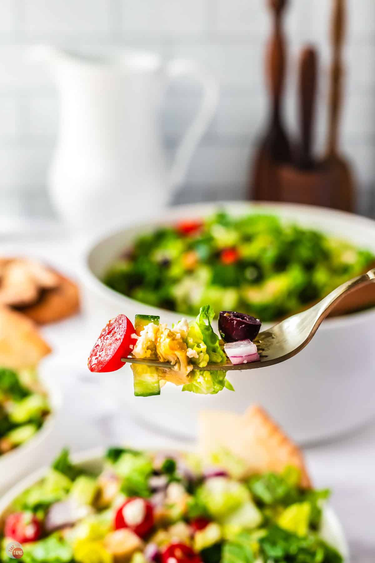 fork with pieces of salad on it
