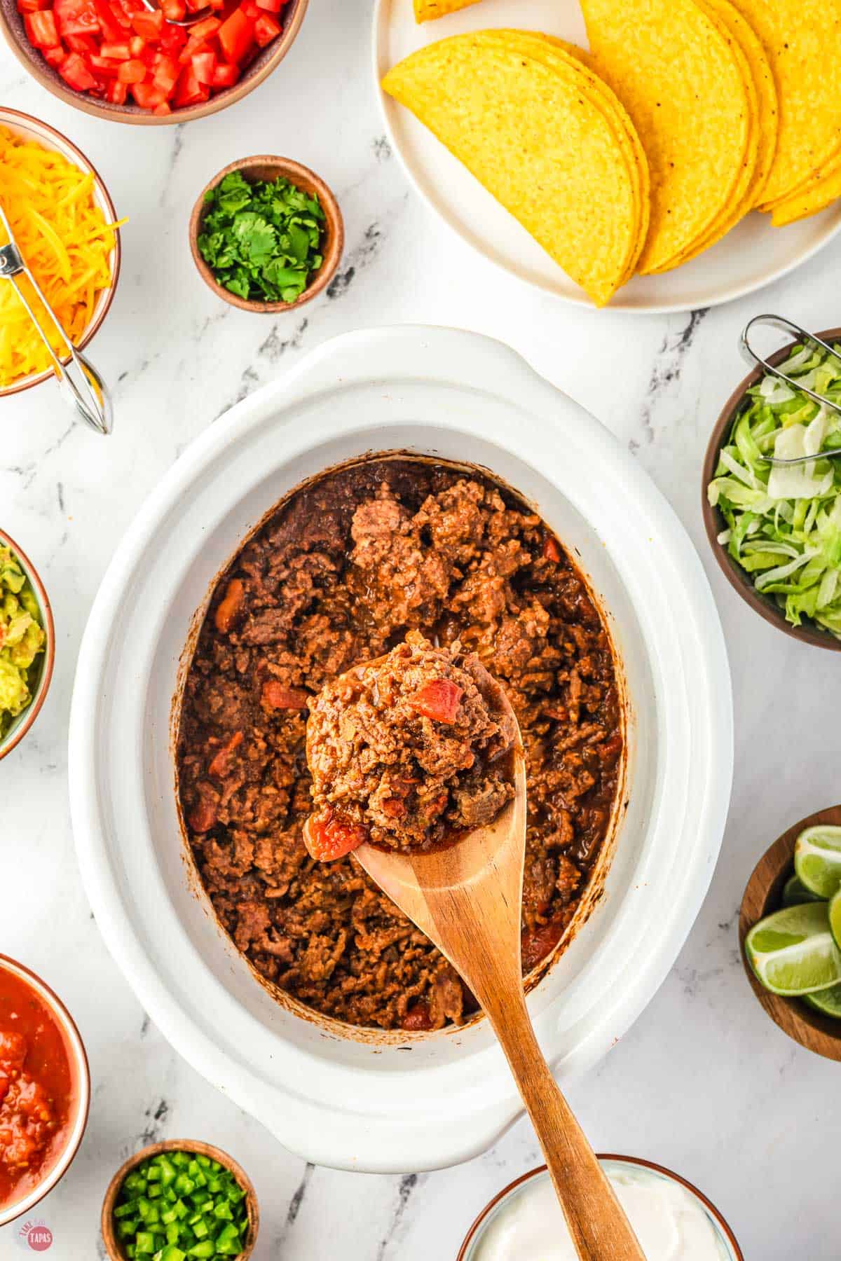wood spoon with a scoop of taco meat on it