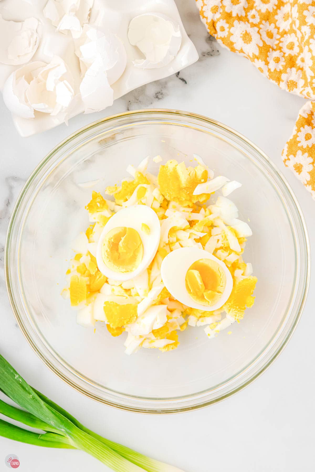 hard boiled eggs diced up in a clear bowl