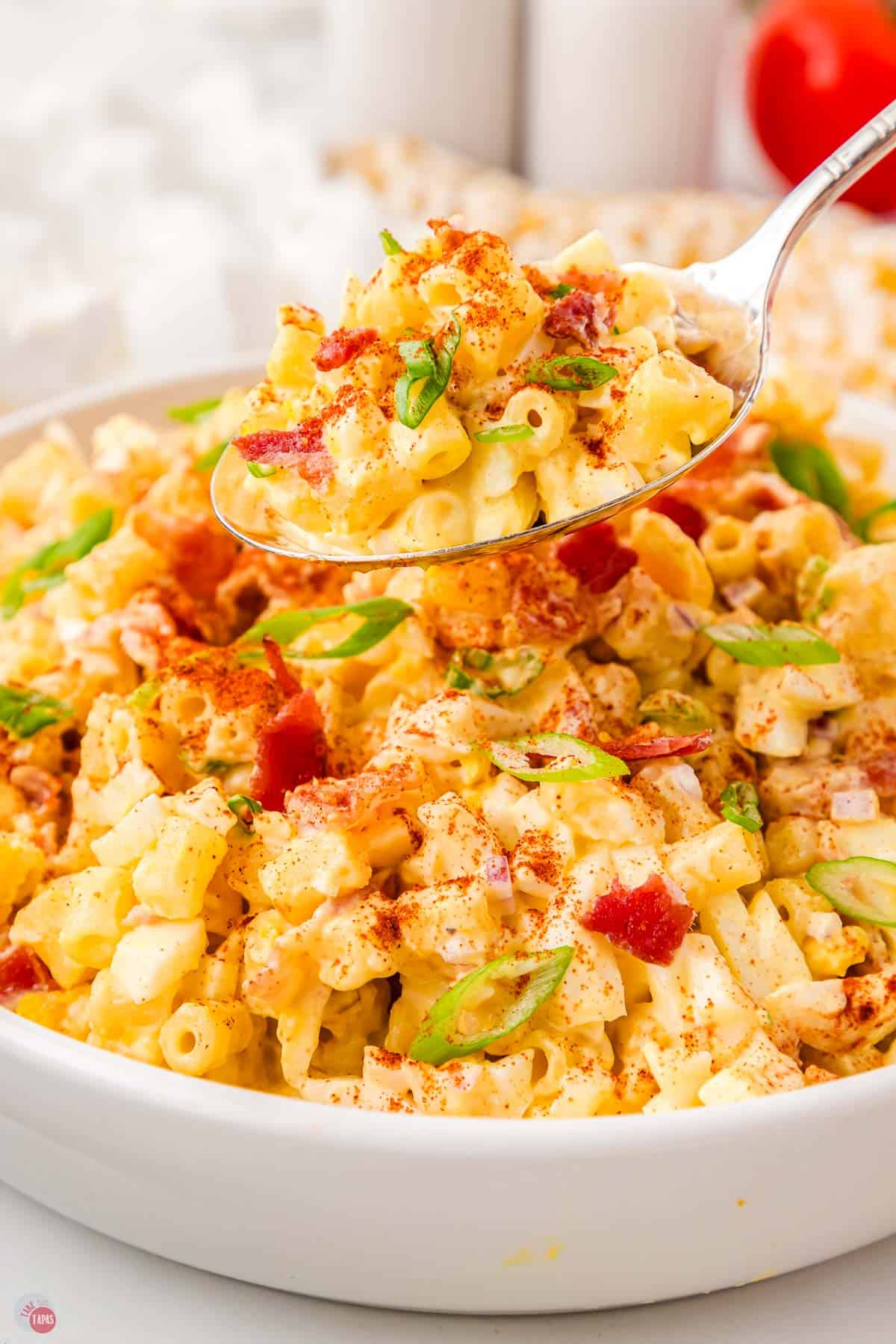 deviled egg pasta salad in a bowl with a spoon