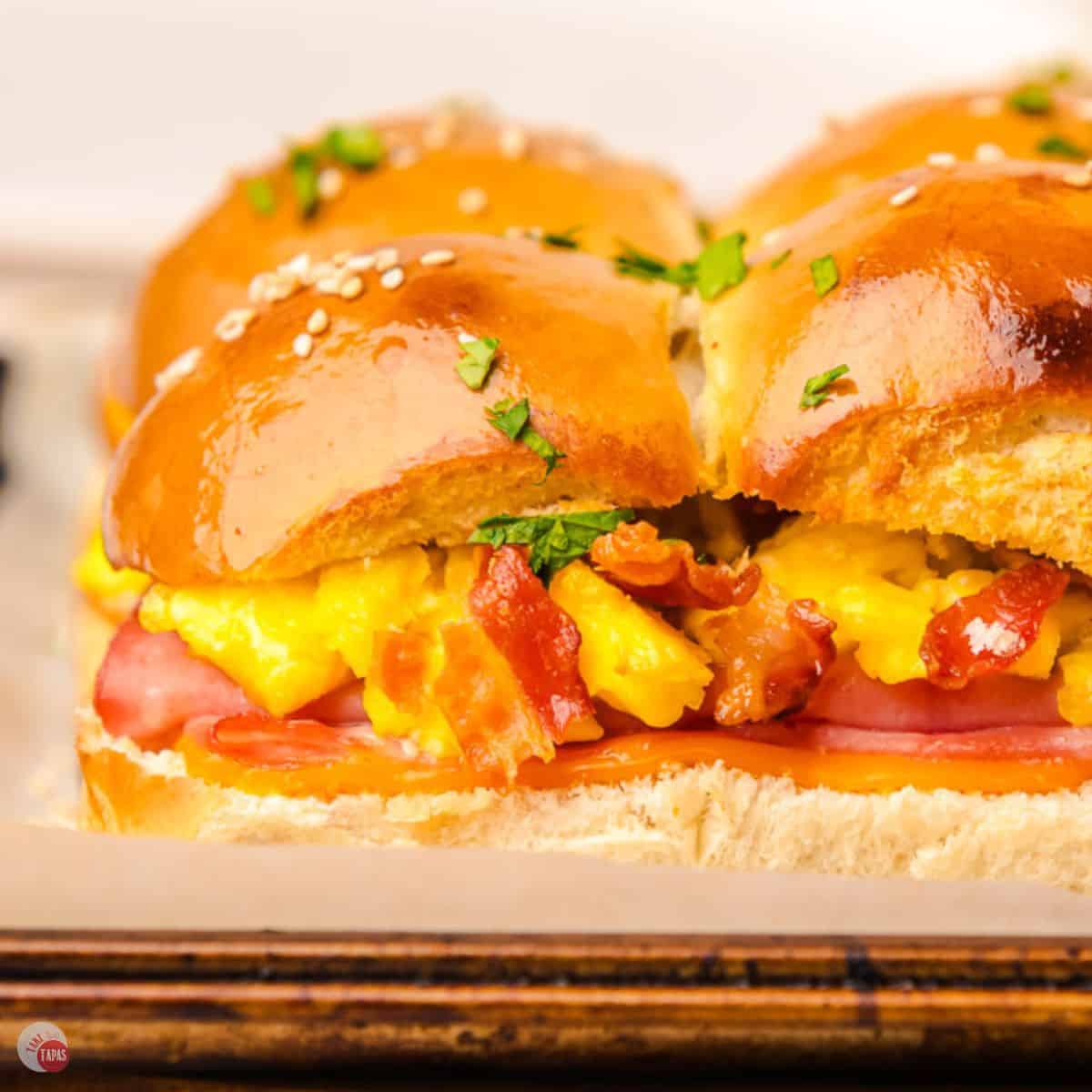 close up side view of 4 breakfast sliders