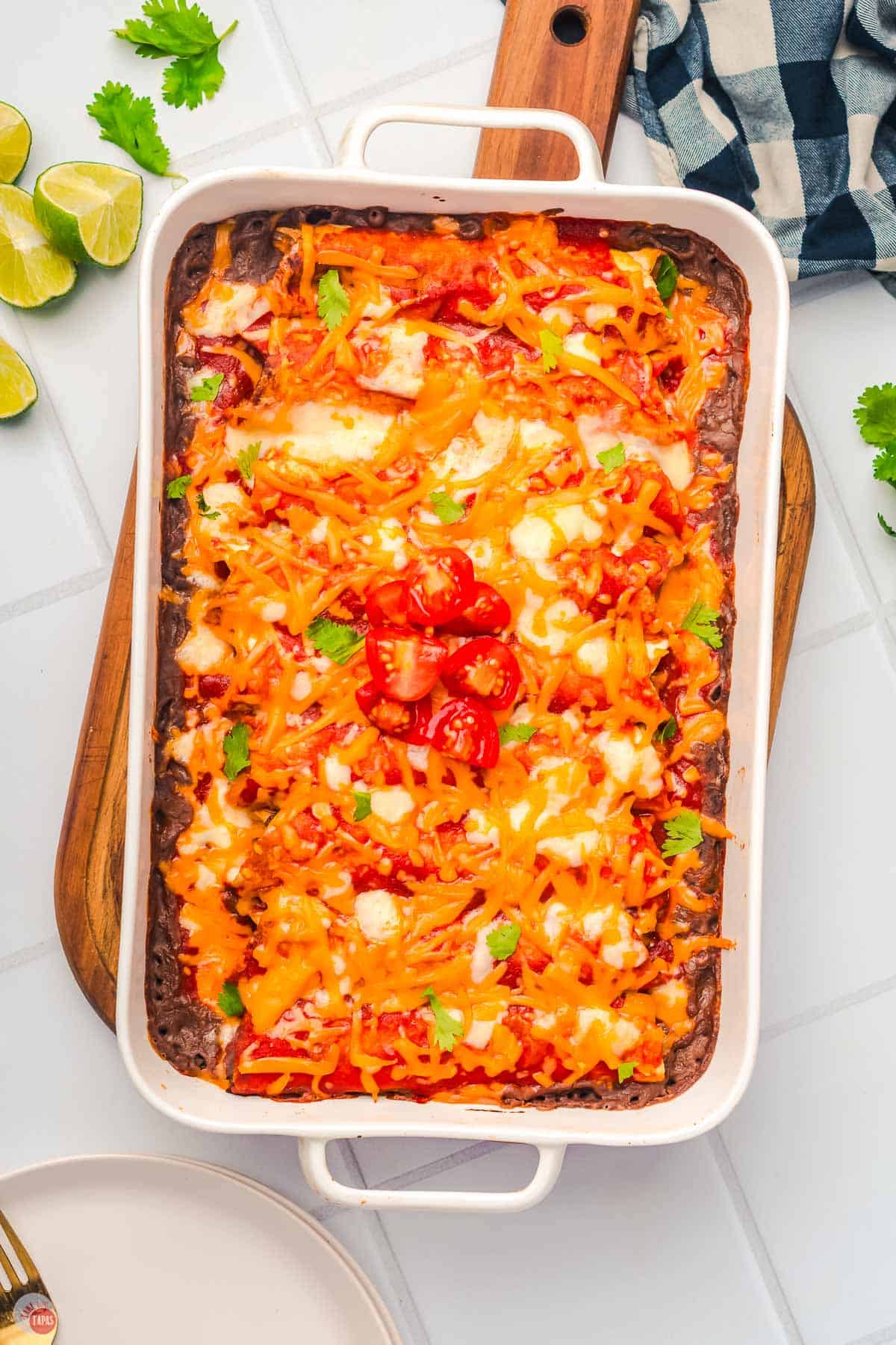 baking dish with cooked enchiladas in it